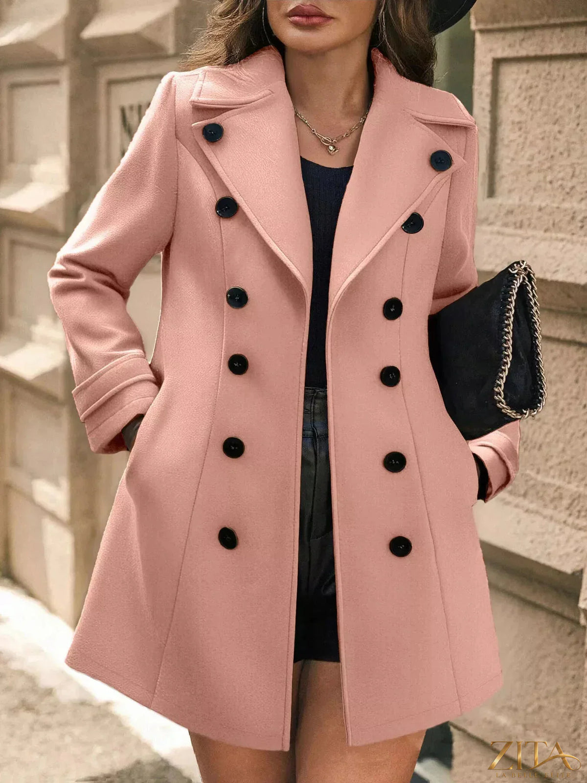 Zita La Belle Elite double-breasted wool blend overcoat with wide lapels and button details, shown hanging on a wooden hanger.