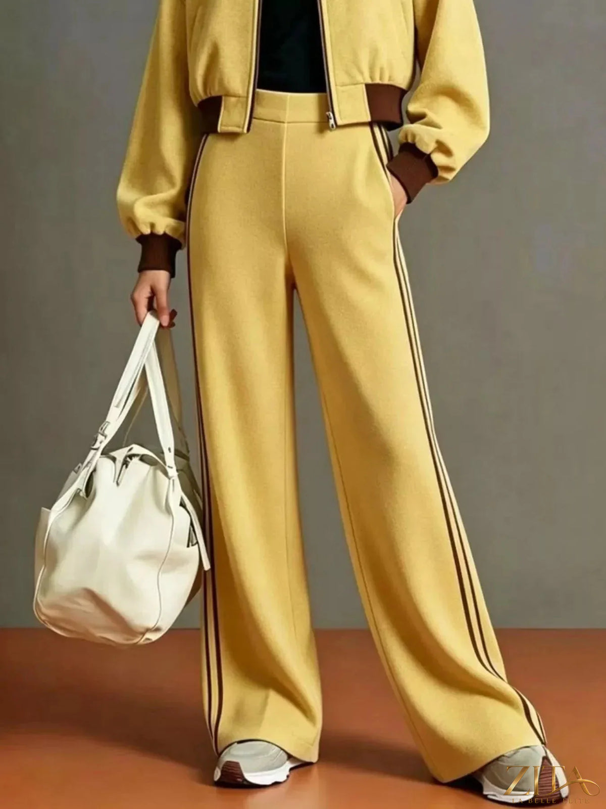 Contrast ribbed jacket and wide-leg pants tracksuit set by Zita La Belle Elite, featuring stylish ribbed fabric and relaxed fit.