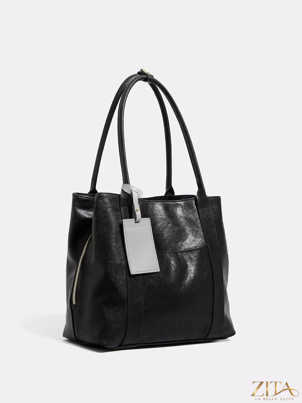 Trendsi PU leather tote bag with sturdy handles and spacious interior, showcasing sleek design and smooth brown finish.