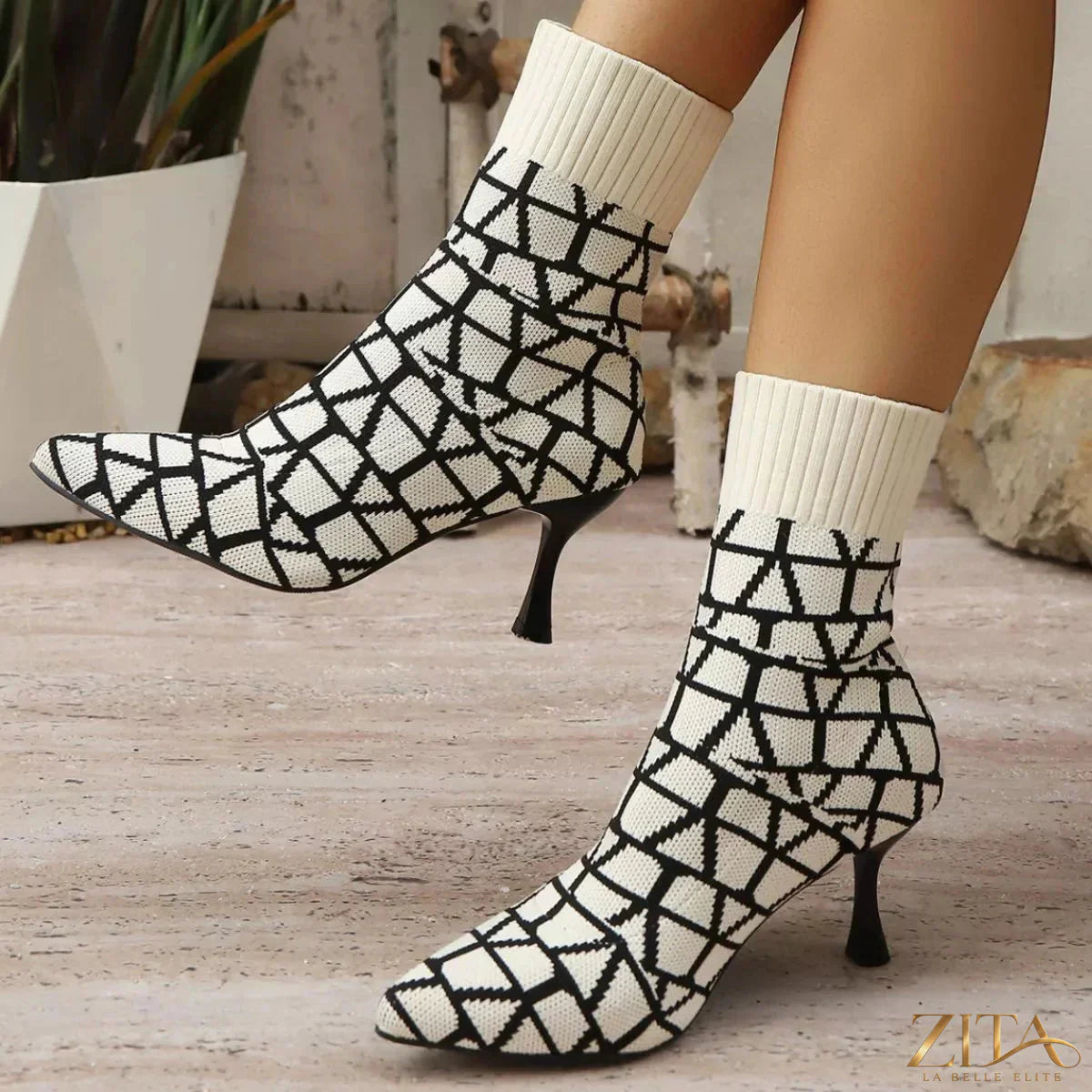 Point toe flared heel boots by Zita La Belle Elite featuring sleek design and stylish silhouette, shown on a model.