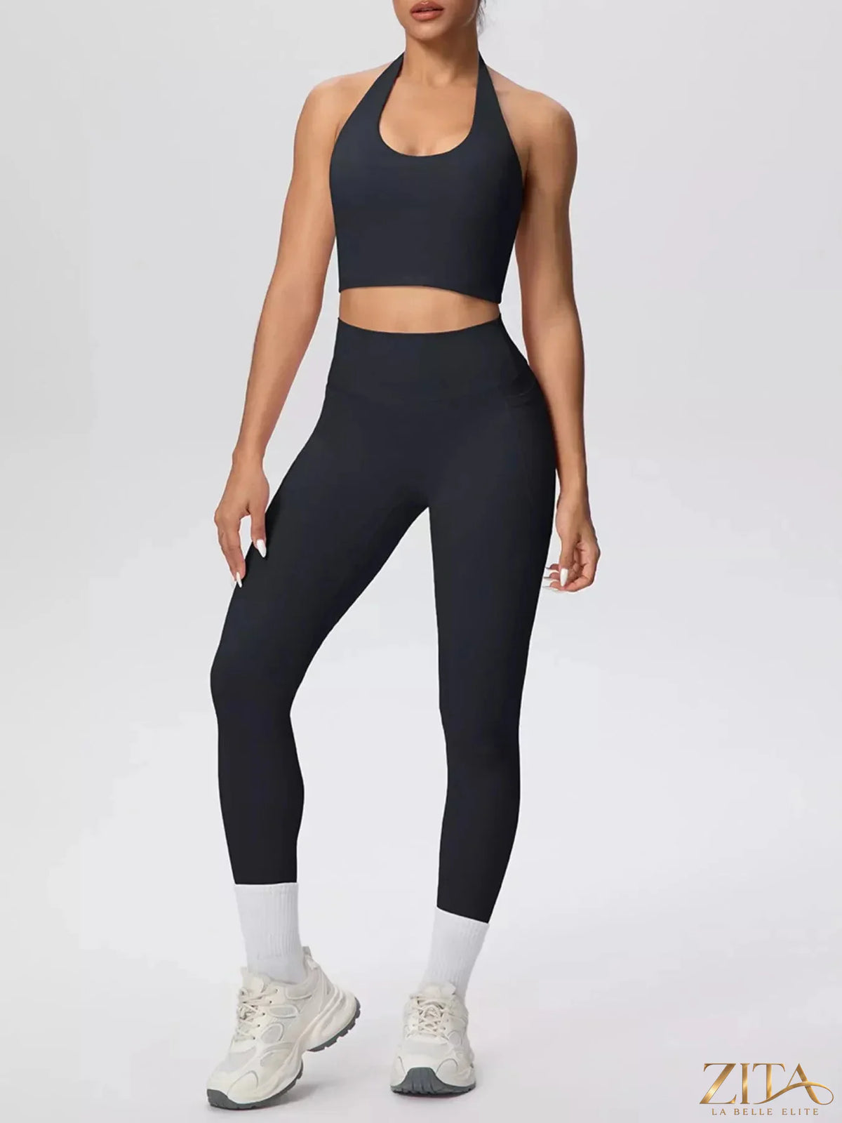 Zita La Belle Elite halter neck crop top and high-waisted leggings active set on a model, showcasing a stylish workout outfit.
