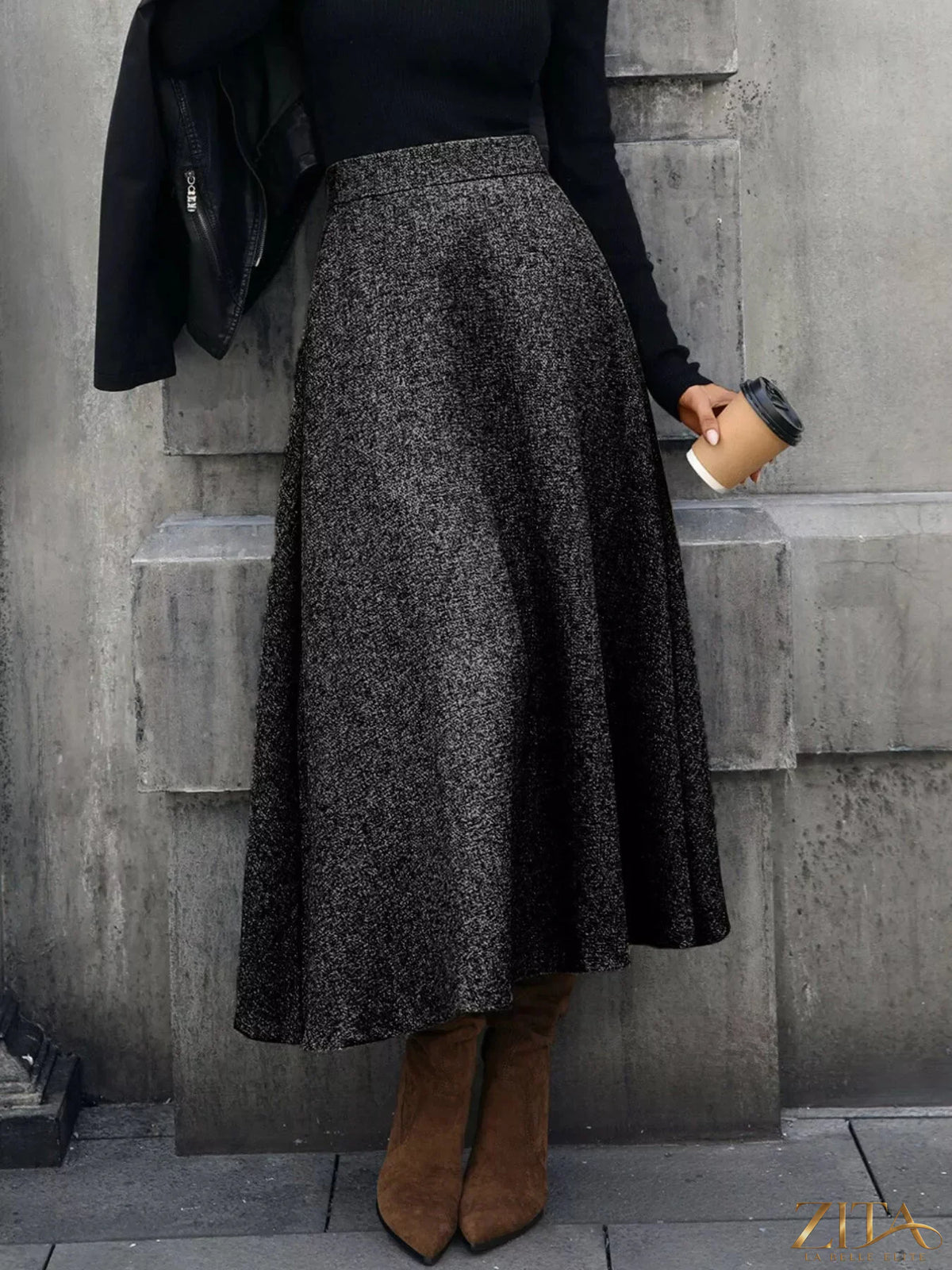 A-line midi skirt by Trendsi featuring a flowy design, high waist, and midi length in a versatile fabric perfect for casual or dressy outfits.