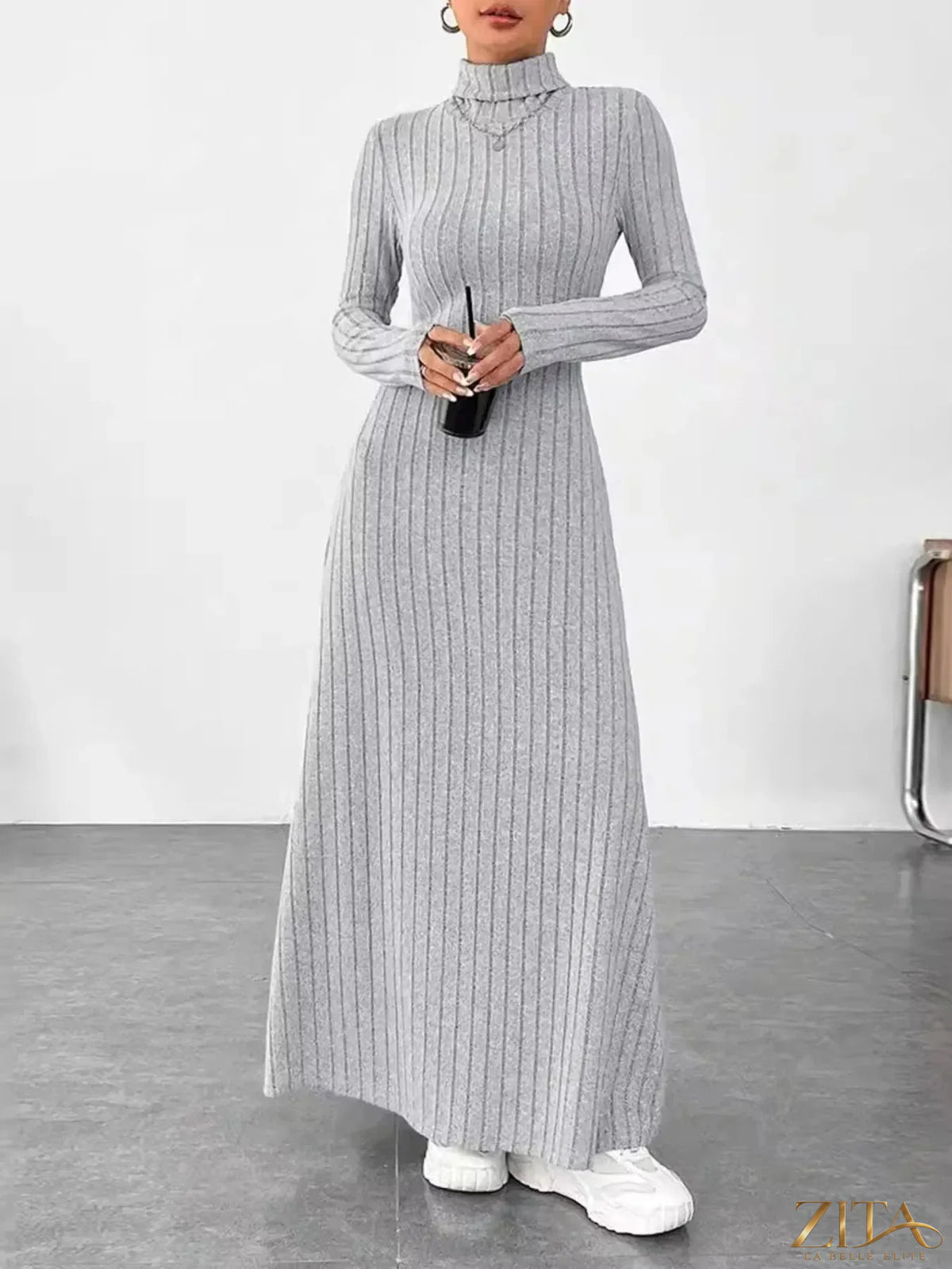 Ribbed turtleneck long sleeve maxi knit dress by Trendsi, featuring a fitted silhouette and textured ribbed fabric.