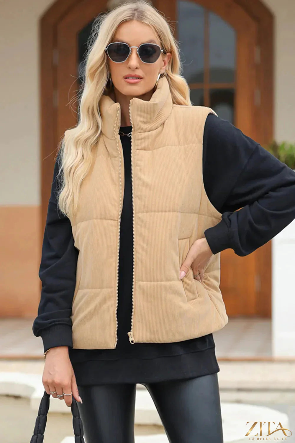 Trendsi pocketed zip-up turtleneck vest coat featuring a high collar, front pockets, and a sleek, fitted design for layered winter style.