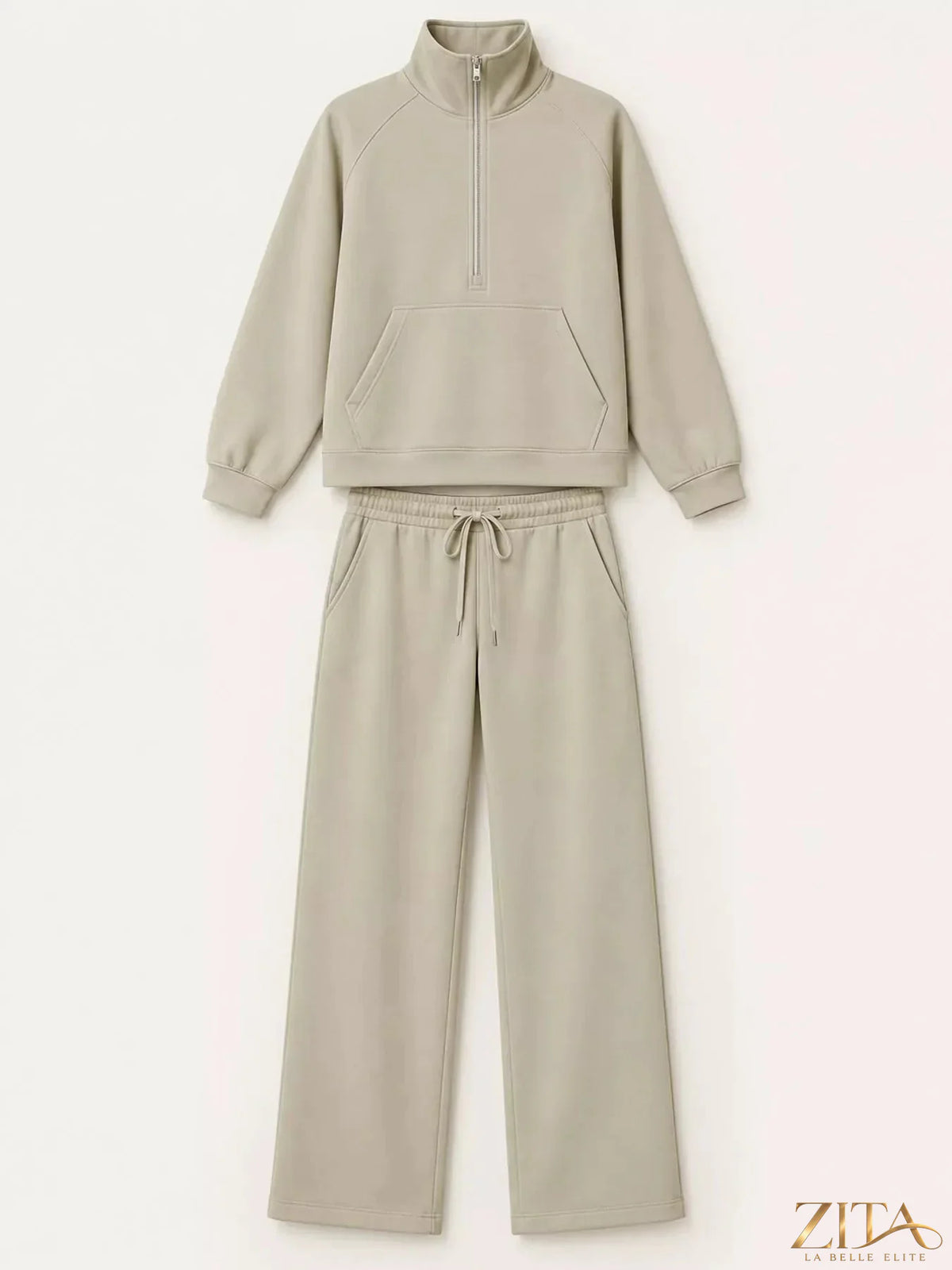 Zita La Belle Elite half-zip sweatshirt and wide-leg pants set in soft fabric, displayed on a hanger against a neutral background.