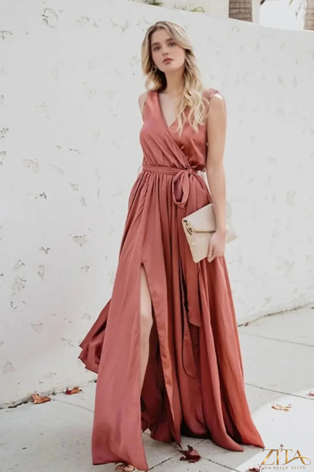 Zita La Belle Elite surplice tie waist maxi dress in flowing fabric with long sleeves and elegant silhouette.