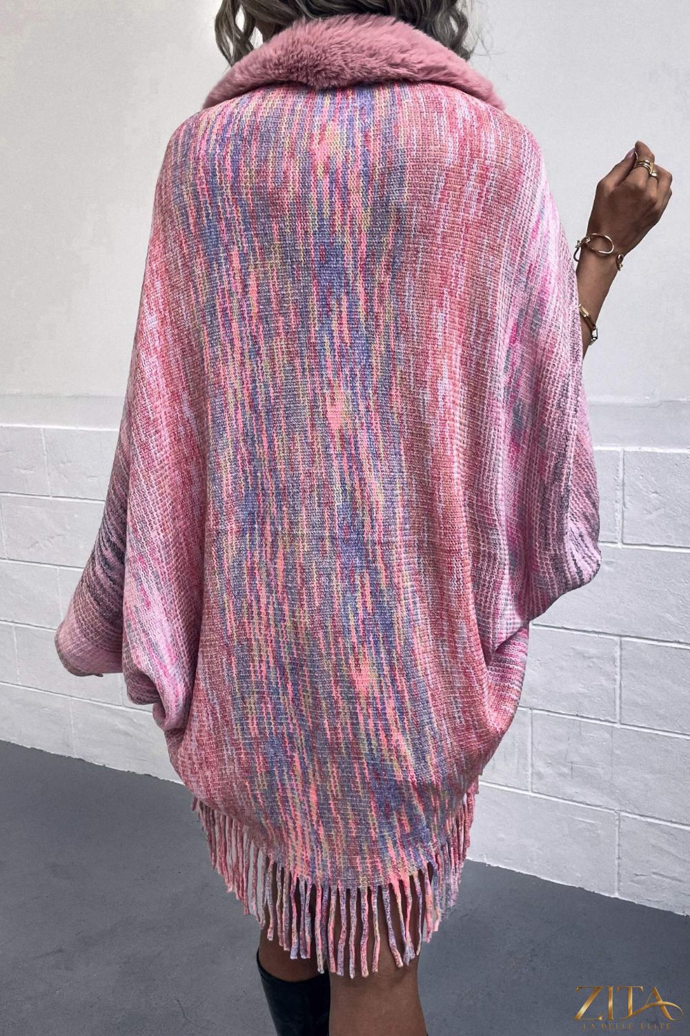 Open front fringe hem poncho by Trendsi featuring a flowy fabric, fringe details, and a relaxed, stylish fit.