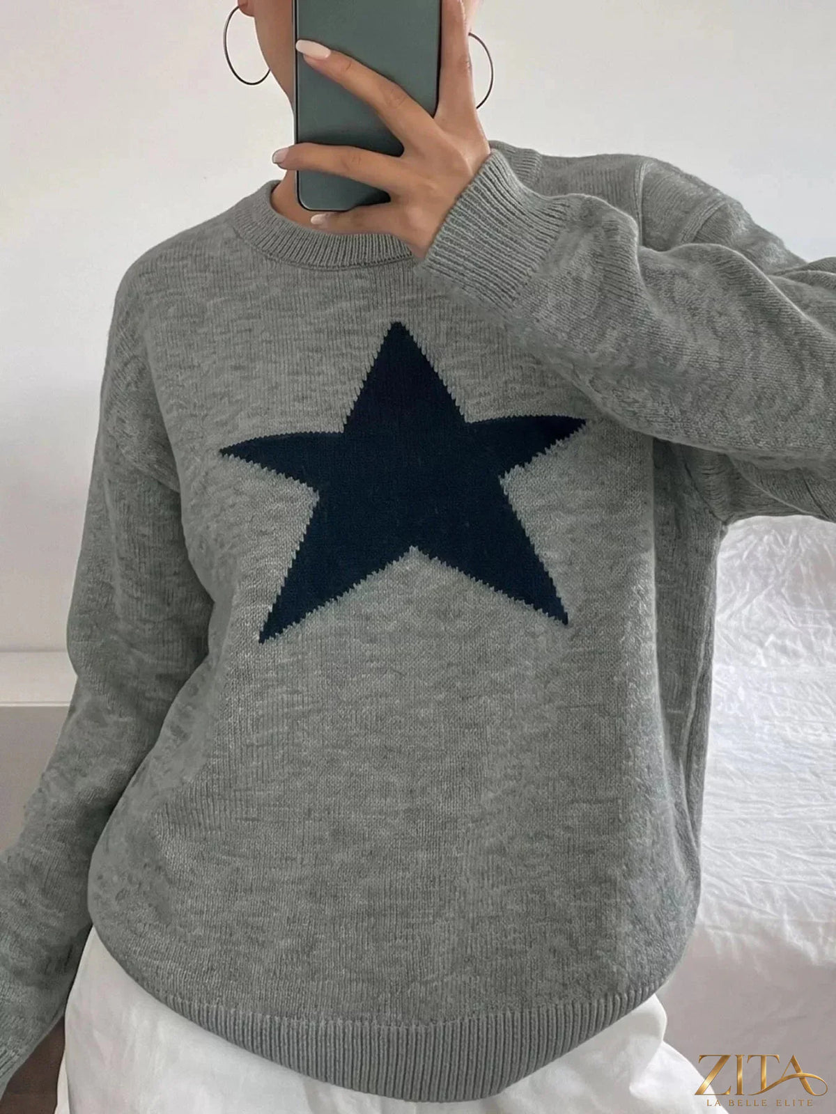 Star-patterned dropped shoulder sweater by Zita La Belle Elite, featuring a cozy knit with star designs and relaxed fit.