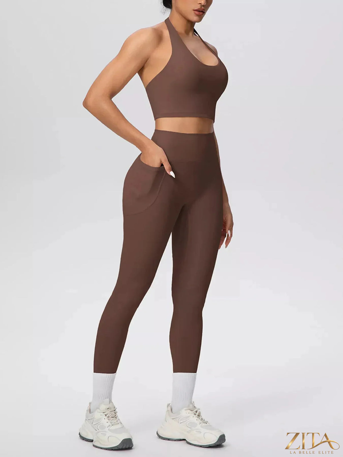 Zita La Belle Elite halter neck crop top and high-waisted leggings active set on a model, showing sporty fit and stylish design.