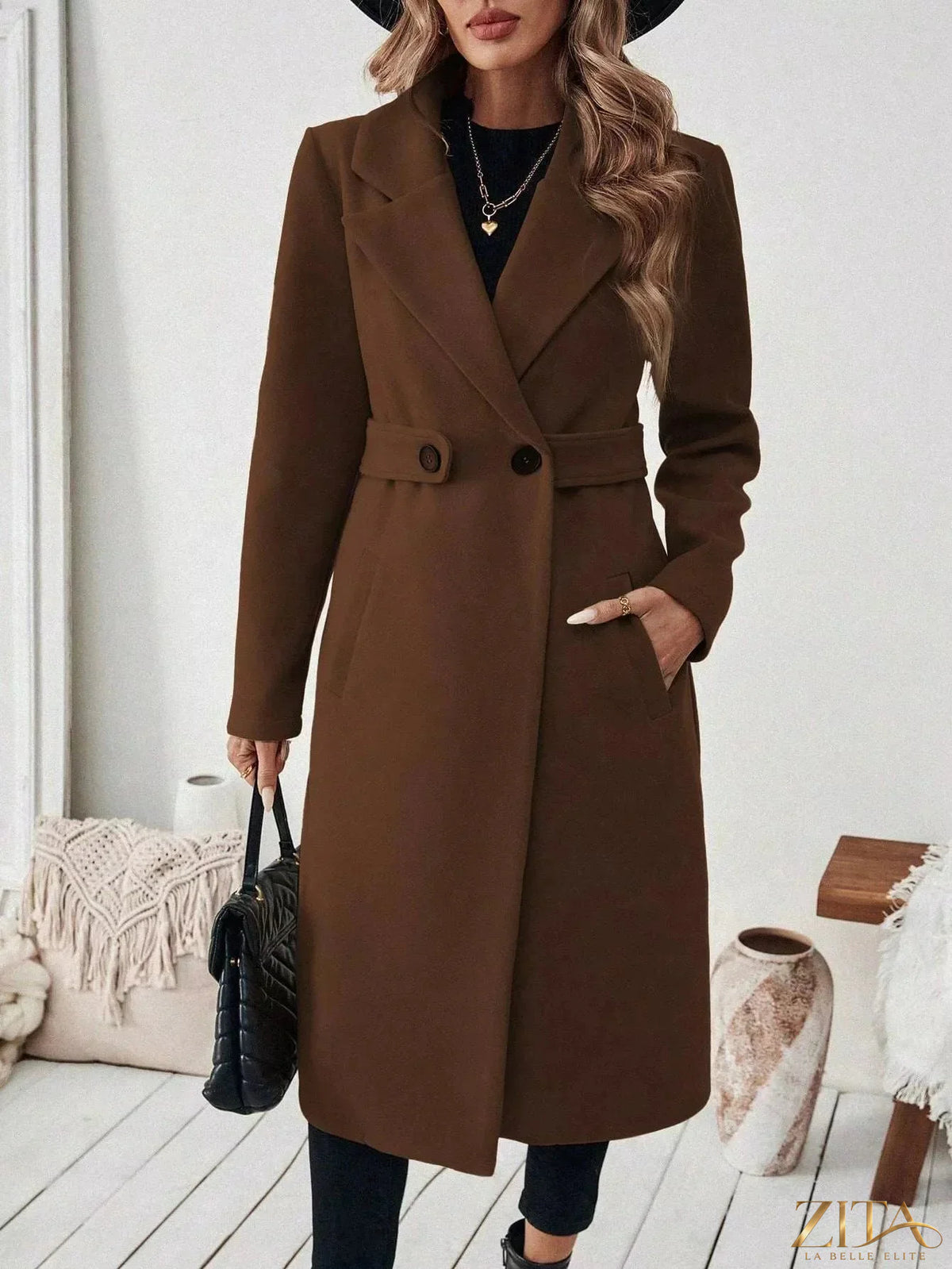 Zita La Belle Elite single-button longline coat displayed on a model, featuring a sleek design and classic silhouette in neutral fabric.