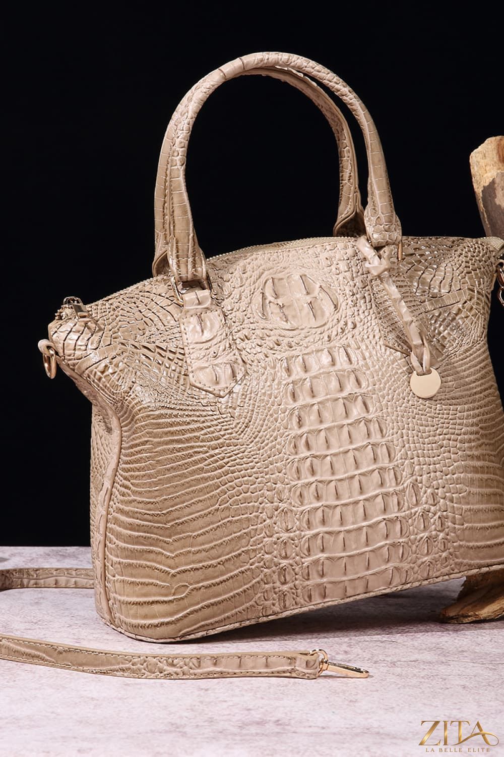 Zita La Belle Elite PU leather handbag with gold accents, featuring a sleek design and sturdy handles on a white background.