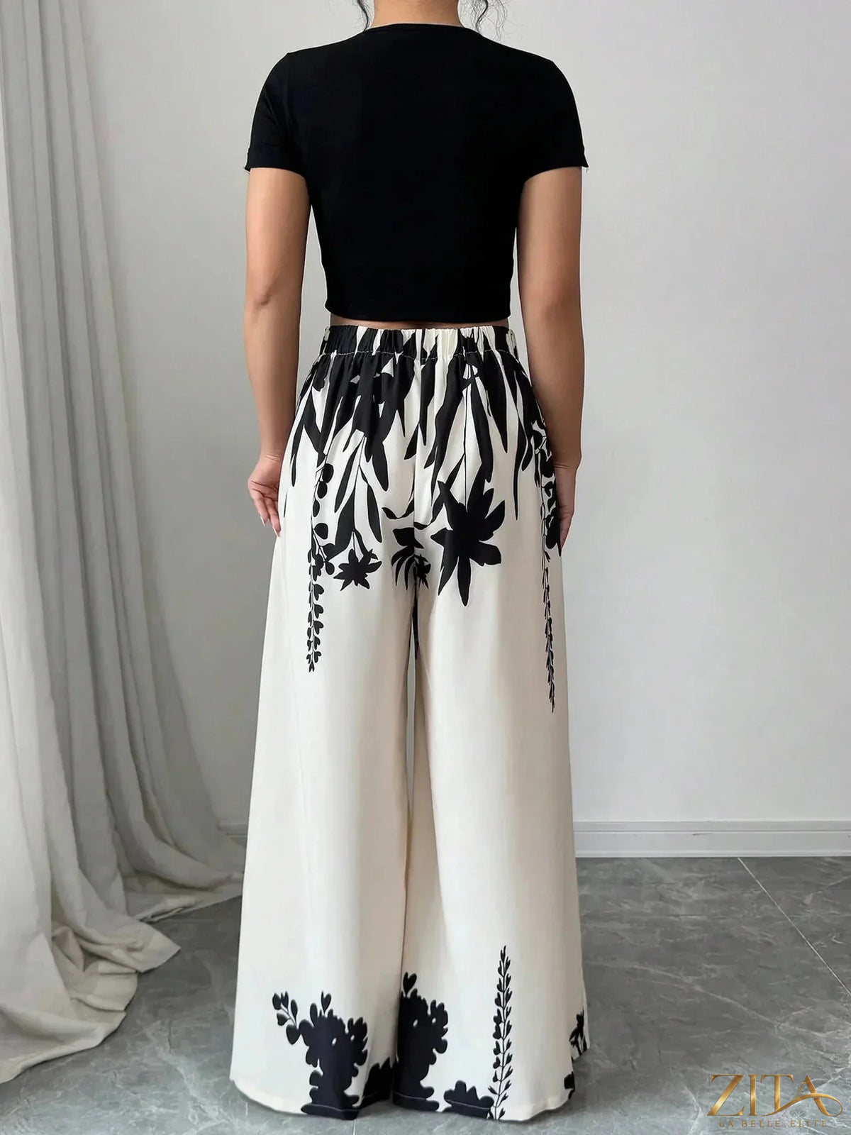 Zita La Belle Elite printed wide leg pants with a flowy, patterned fabric and high-waisted design displayed in the image.