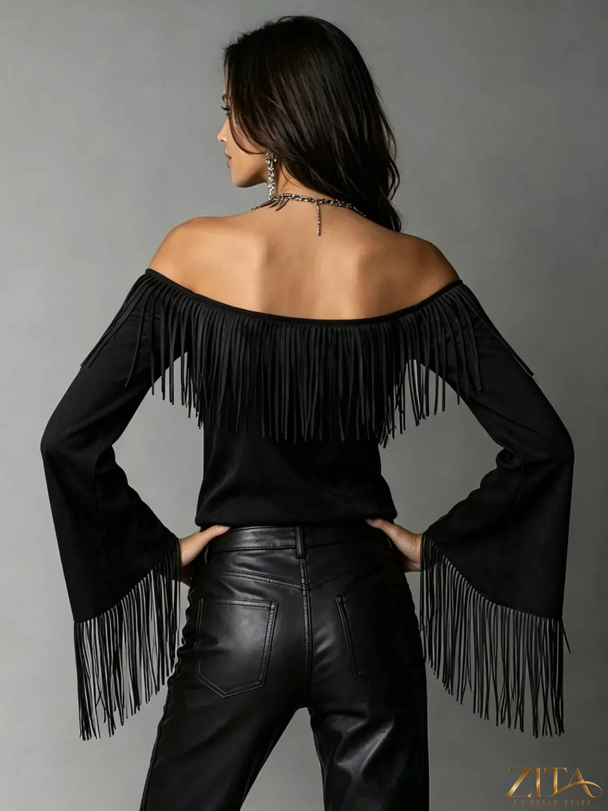 Plus size fringed off-shoulder T-shirt by Trendsi featuring a full size, casual design with fringed accents on the shoulders.