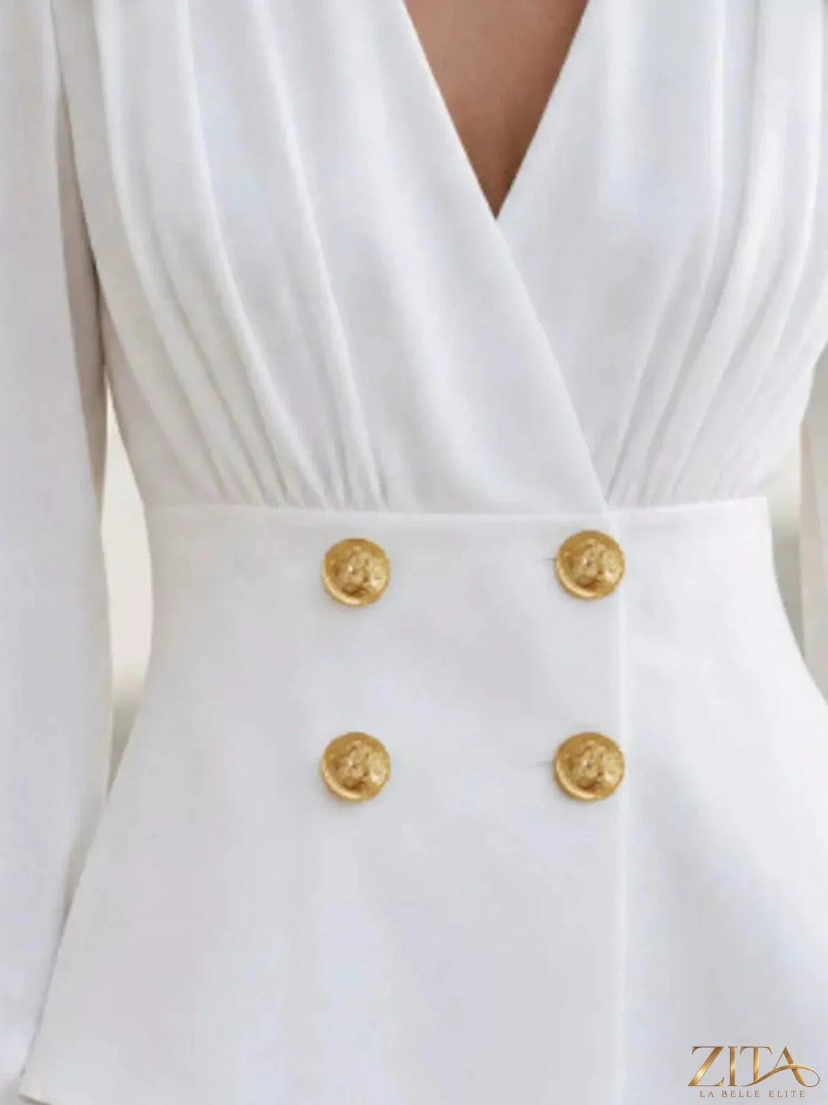 Zita La Belle Elite double-breasted peplum blouse with gold buttons, stylish and tailored women's top displayed on a mannequin.