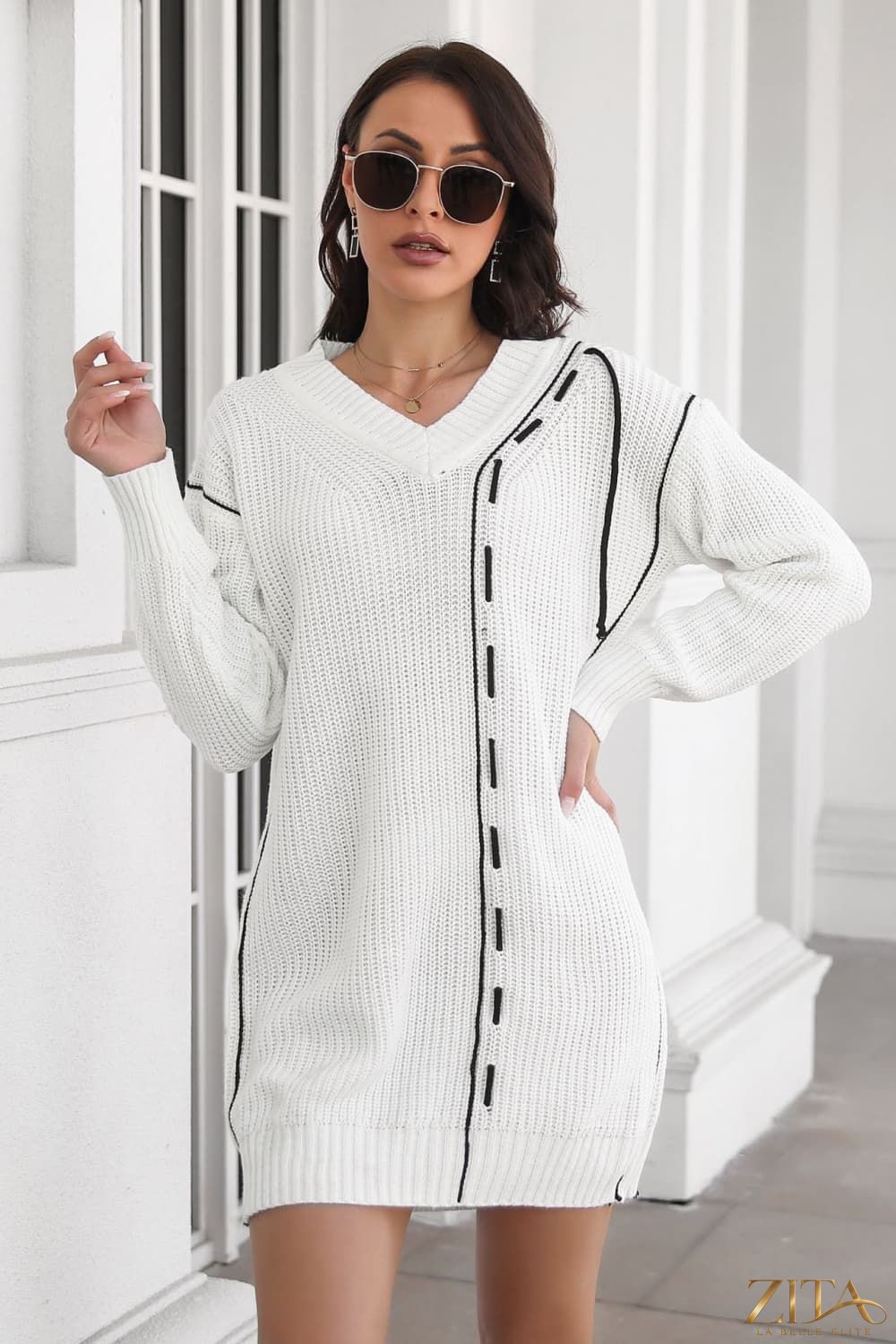 Contrast V-neck sweater dress by Trendsi featuring a fitted silhouette and long sleeves, displayed on a model.