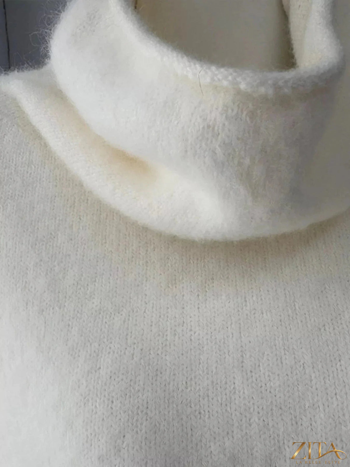 Zita La Belle Elite fuzzy short sleeve turtleneck sweater in soft, cozy fabric with a fitted silhouette and ribbed collar.