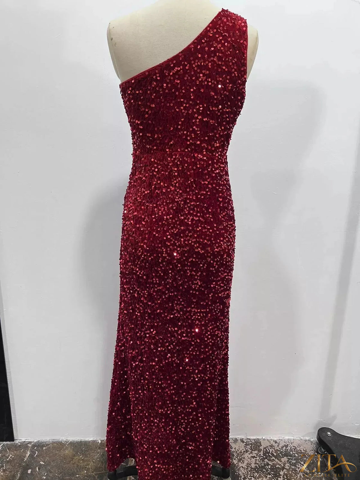Zita La Belle Elite one-shoulder ruched sequin evening dress with high slit, elegant formal gown, shiny sequin details, and asymmetrical design.