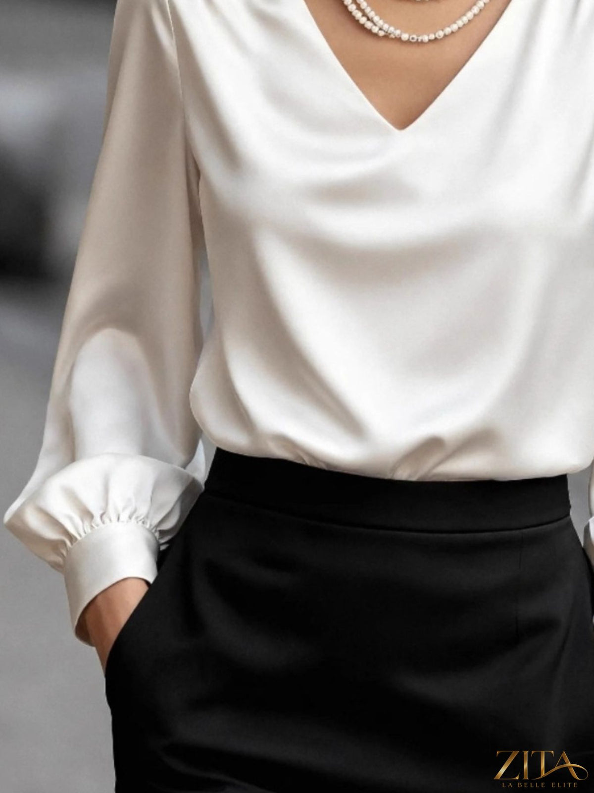 Zita La Belle Elite satin V-neck long sleeve blouse in soft, shiny fabric, displayed on a mannequin.