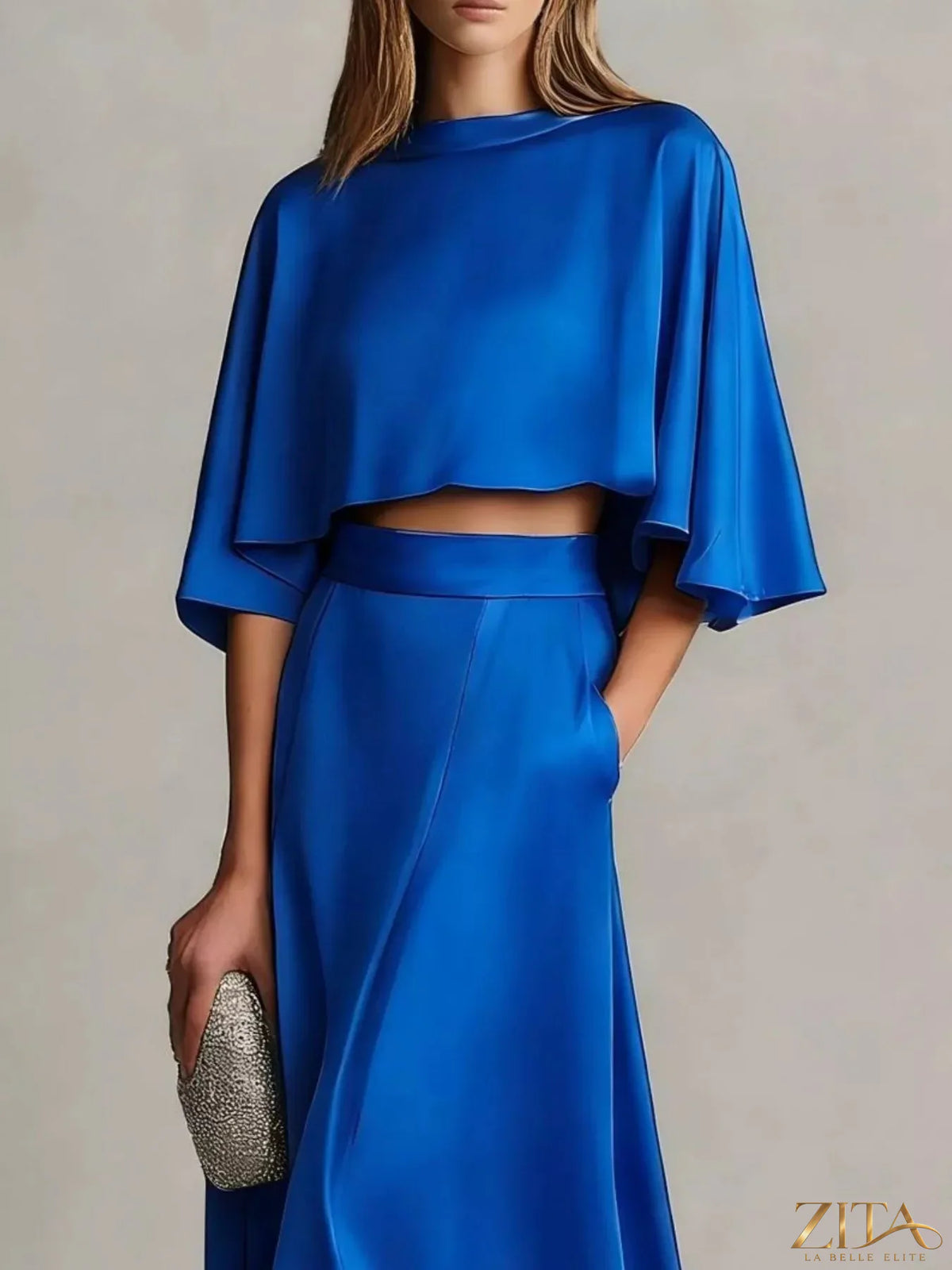 Plus size satin crop top and maxi skirt set by Zita La Belle Elite, featuring a stylish two-piece ensemble in elegant satin fabric.