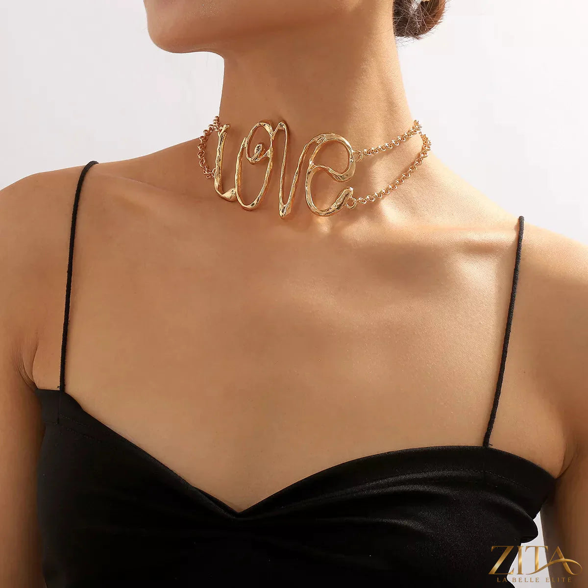 Gold wire love script necklace by Zita La Belle Elite featuring a delicate, elegant love-shaped pendant on a fine chain
