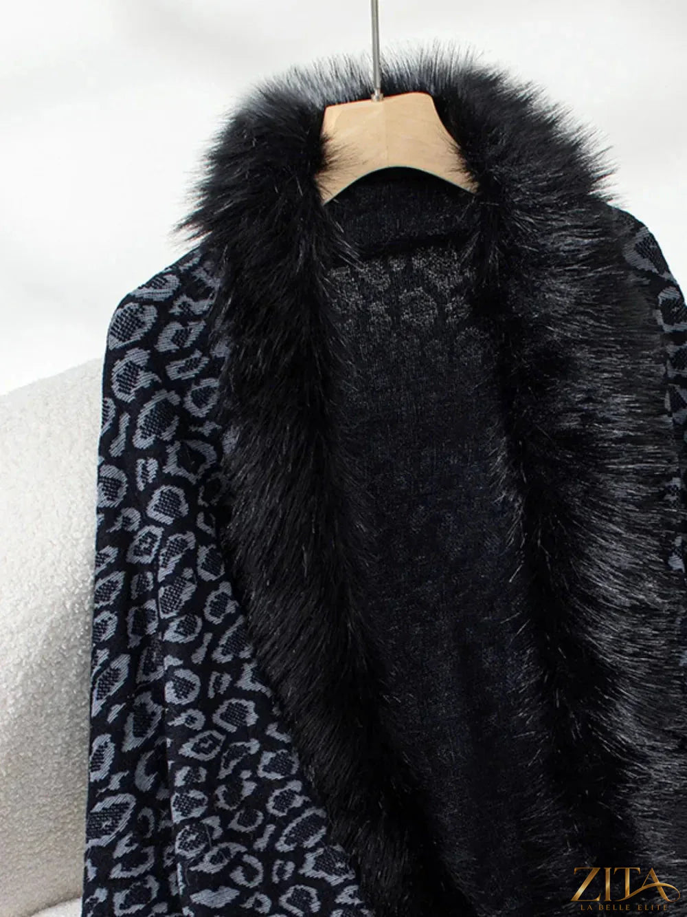 Leopard print fringe open front long sleeve poncho by Trendsi, lightweight with stylish fringed hem and cozy fit.