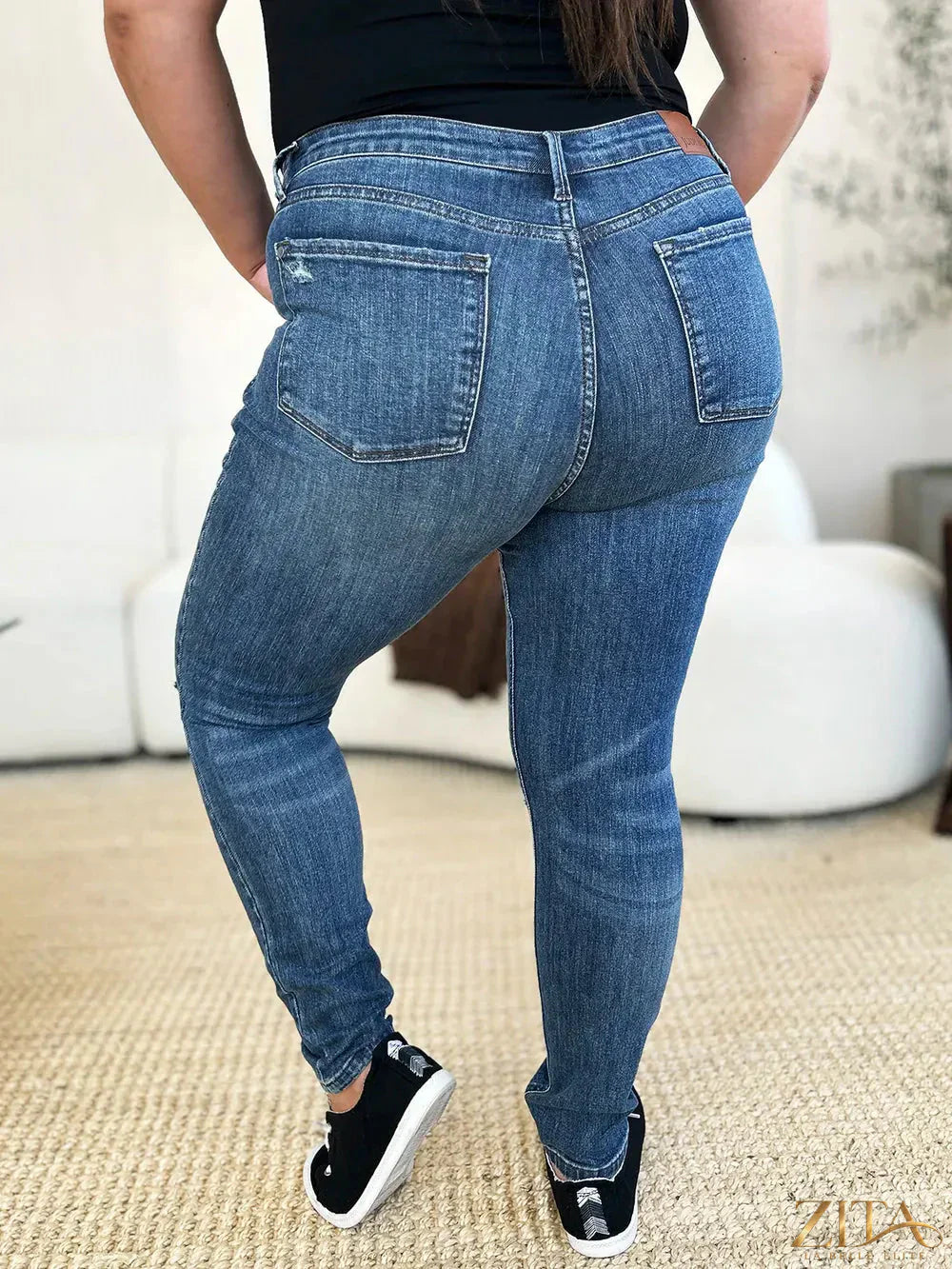 Zita La Belle Elite Judy Blue full size mid waist distressed slim jeans with faded and ripped details on a model.