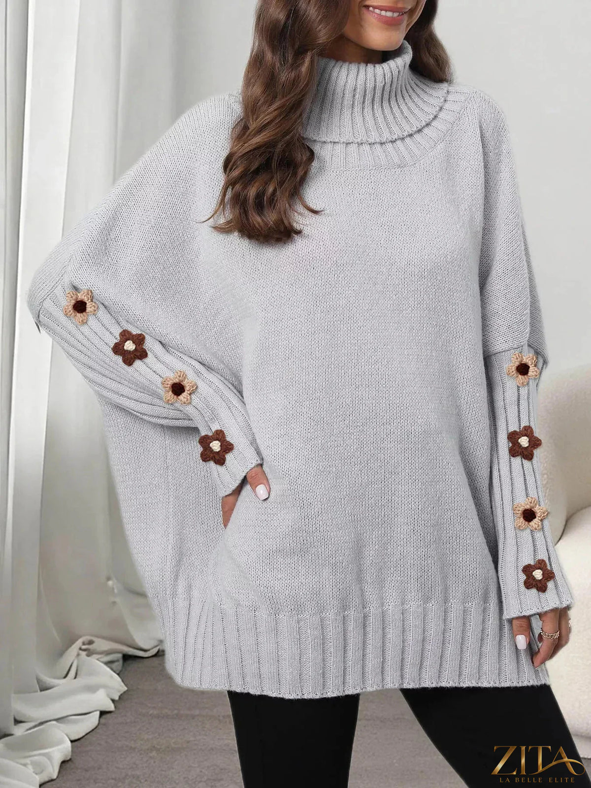Zita La Belle Elite oversized turtleneck sweater with floral applique sleeves in soft knit fabric, cozy and stylish.