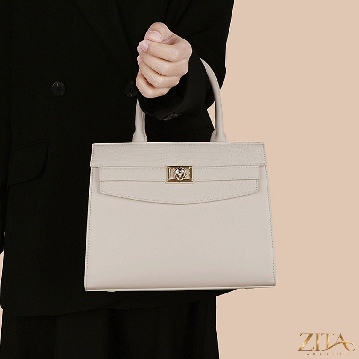 Zita La Belle Elite top handle leather handbag with sleek design and sturdy handle, showcasing elegant craftsmanship and smooth leather finish.