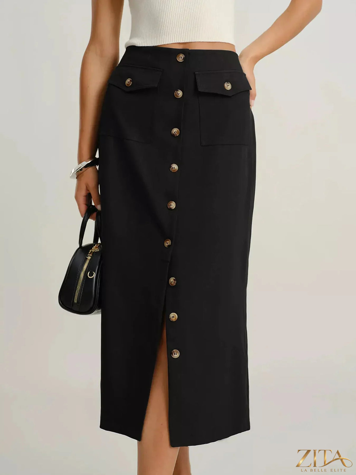 Button-front pocketed midi skirt by Trendsi, featuring a flowy fabric and functional front pockets, styled for casual wear.