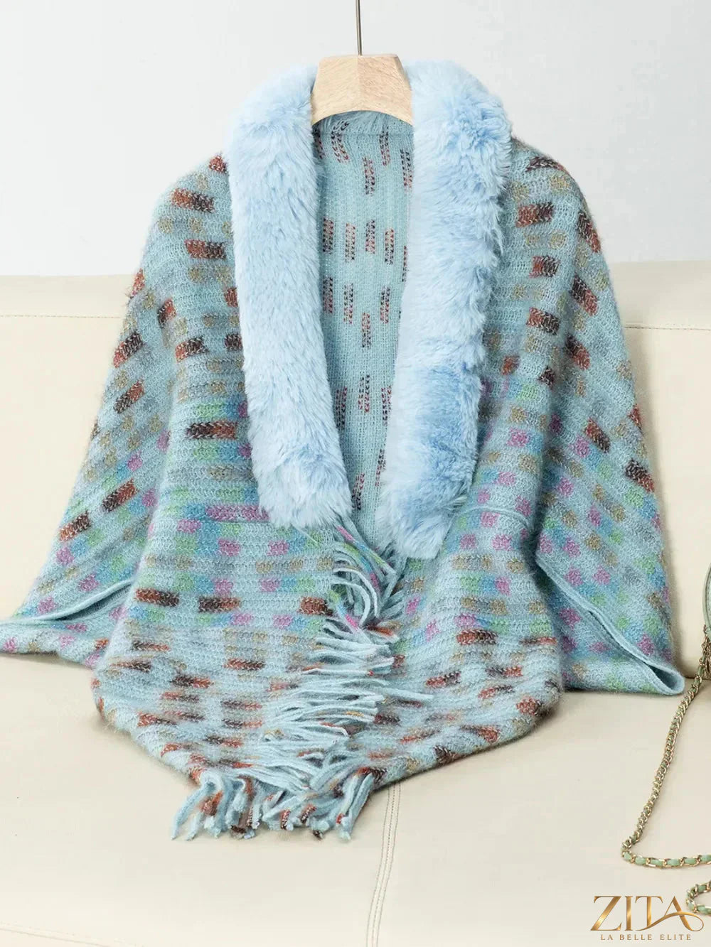 Fuzzy open front fringe poncho from Trendsi with soft texture and stylish design, perfect for cozy layered outfits.