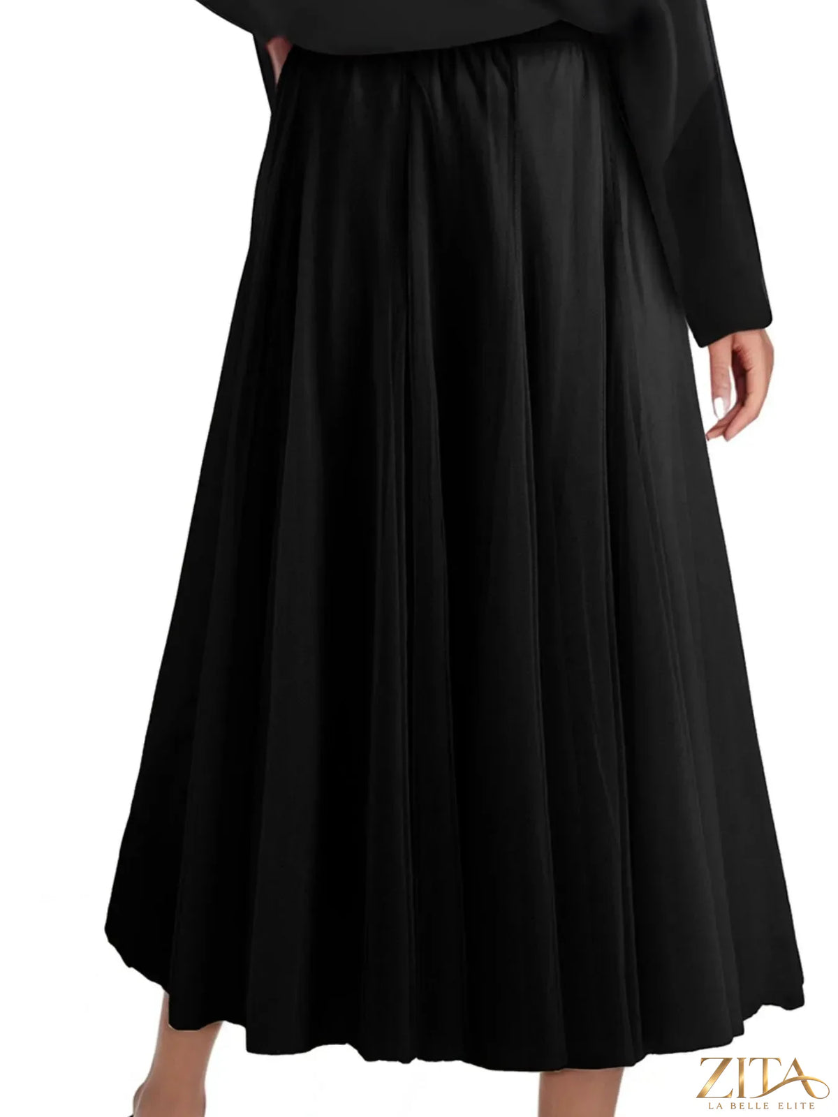 High-waisted midi skirt from Trendsi featuring a flowing design and neutral color, shown on a model.