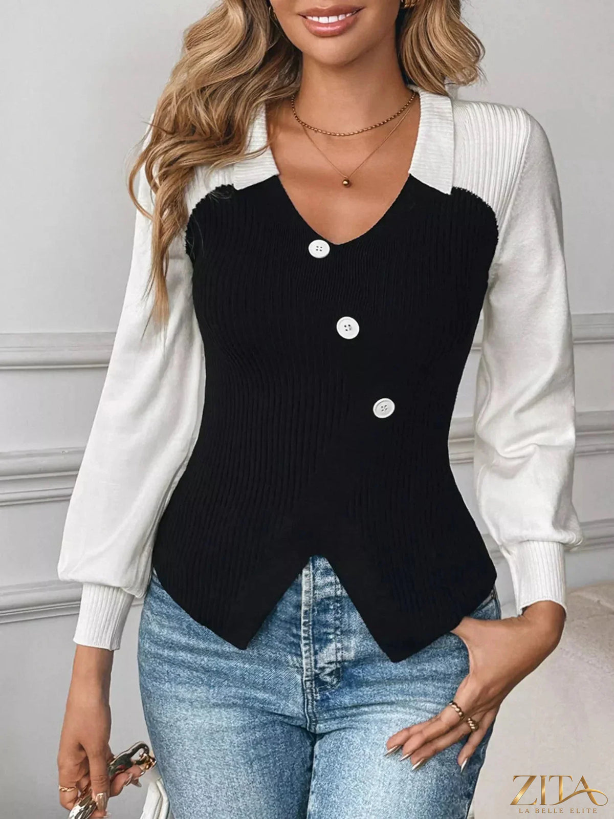 Color block V-neck sweater by Zita La Belle Elite featuring bold color blocks and a classic V-neck design on a model.