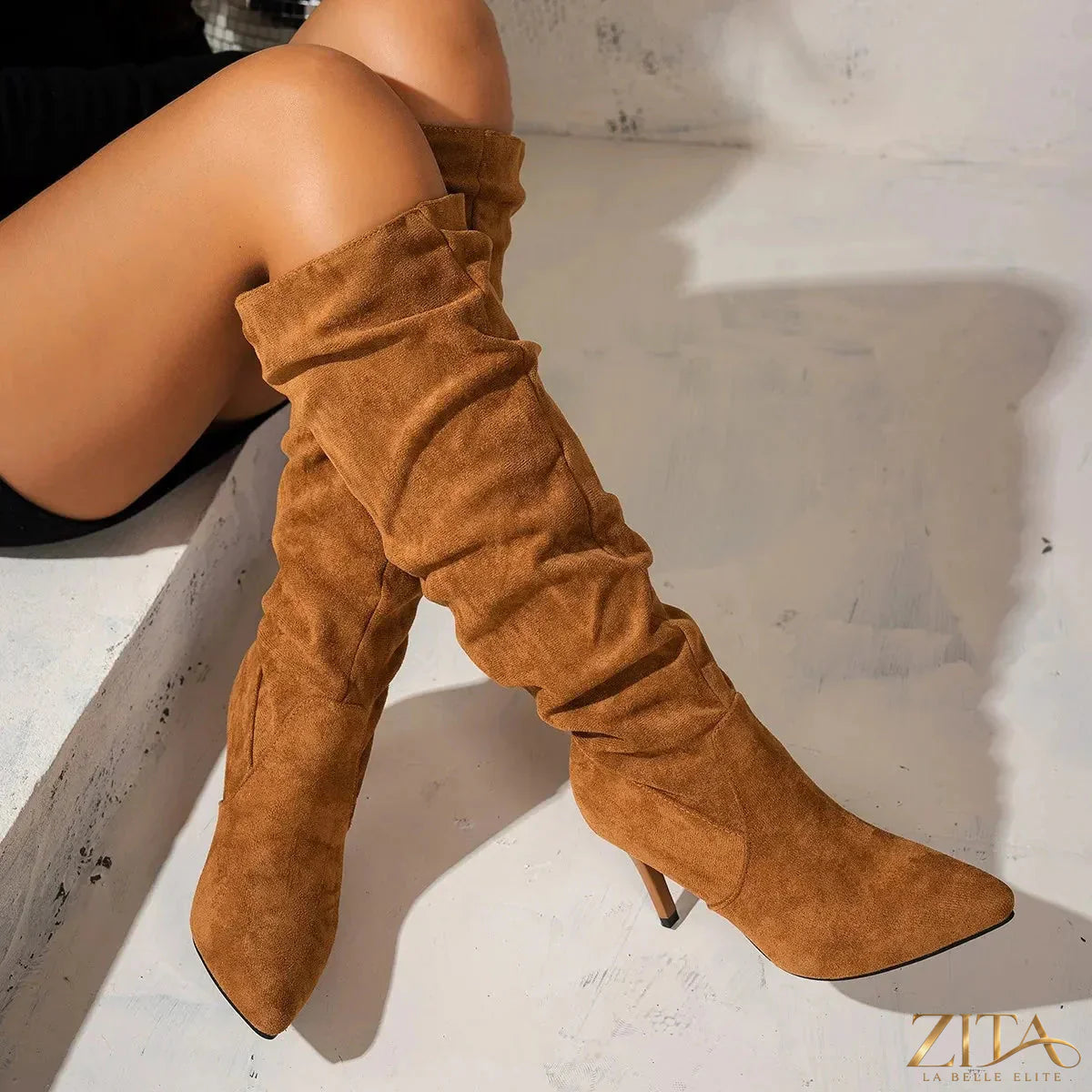 Point toe stiletto boots from Trendsi featuring sleek design and high heel, perfect for stylish evening wear.
