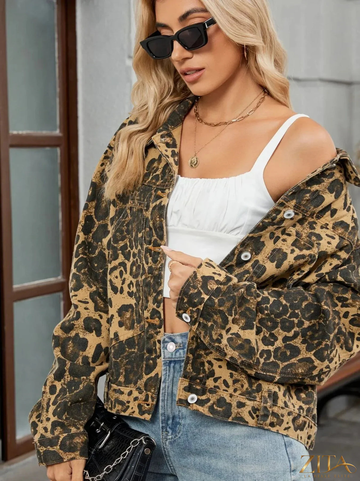 Leopard print button-up denim jacket from Trendsi, featuring classic collar and long sleeves, styled on a hanger.