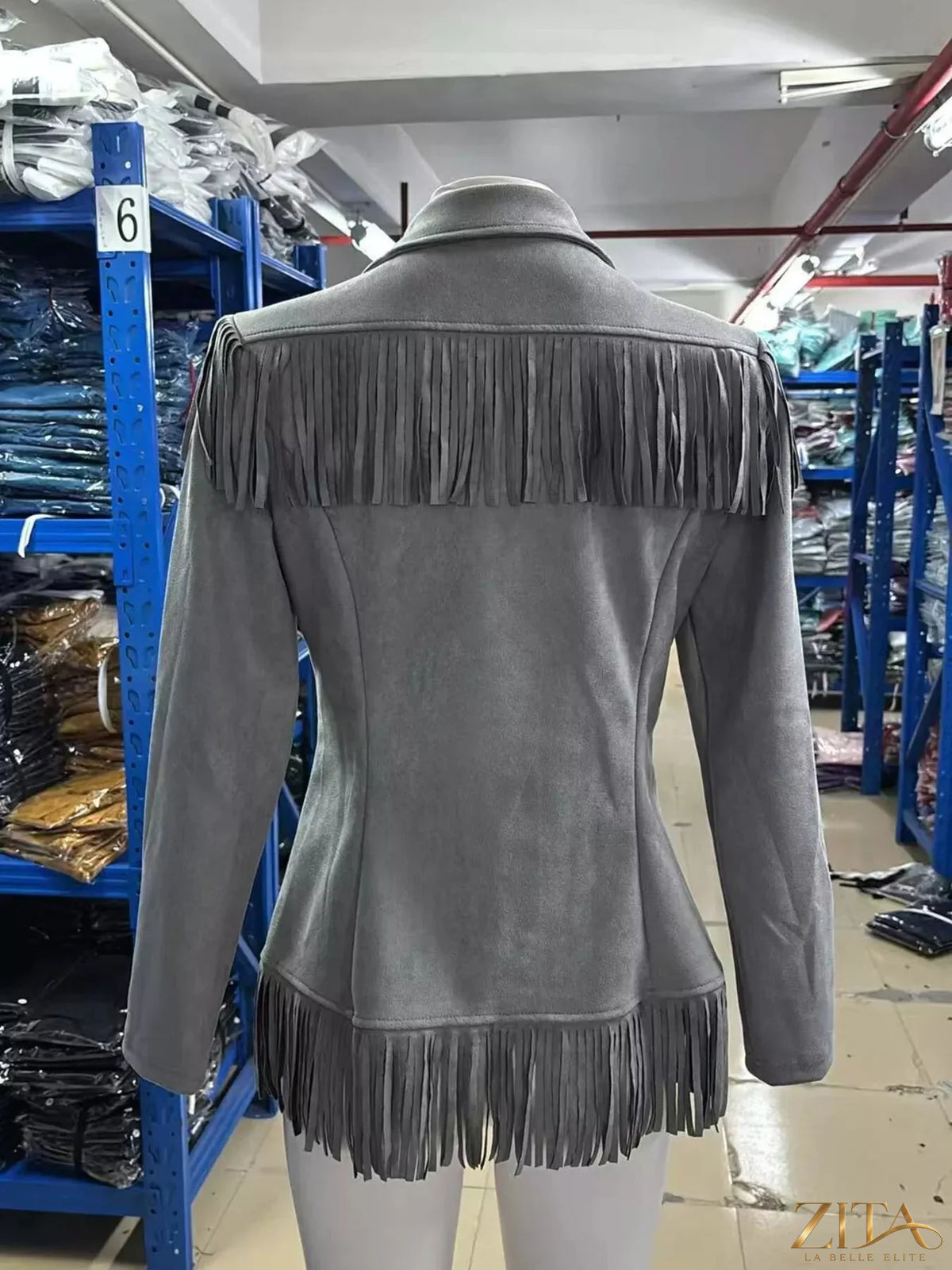 Western-inspired fringed open front jacket by Trendsi, showing a stylish jacket with fringe detailing and a relaxed fit.