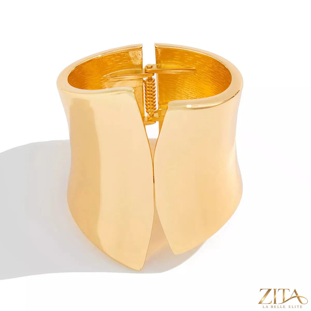 Wide cuff bracelet by Zita La Belle Elite featuring a sleek, modern design in polished metal, displayed on a neutral background.