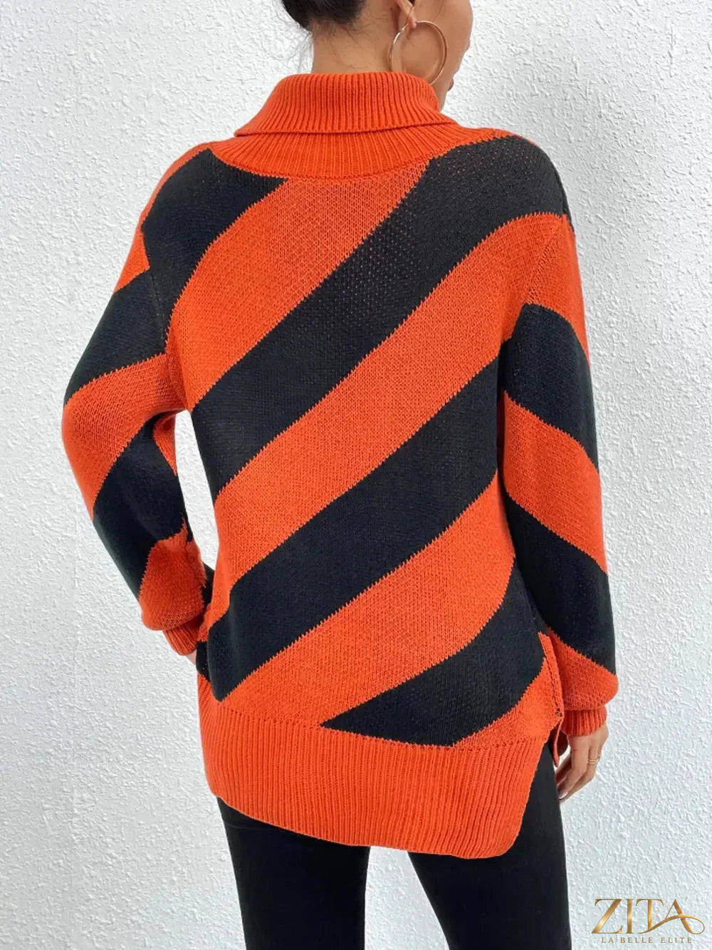 Striped turtleneck dropped shoulder sweater by Trendsi, featuring a cozy knit with bold horizontal stripes and relaxed fit.