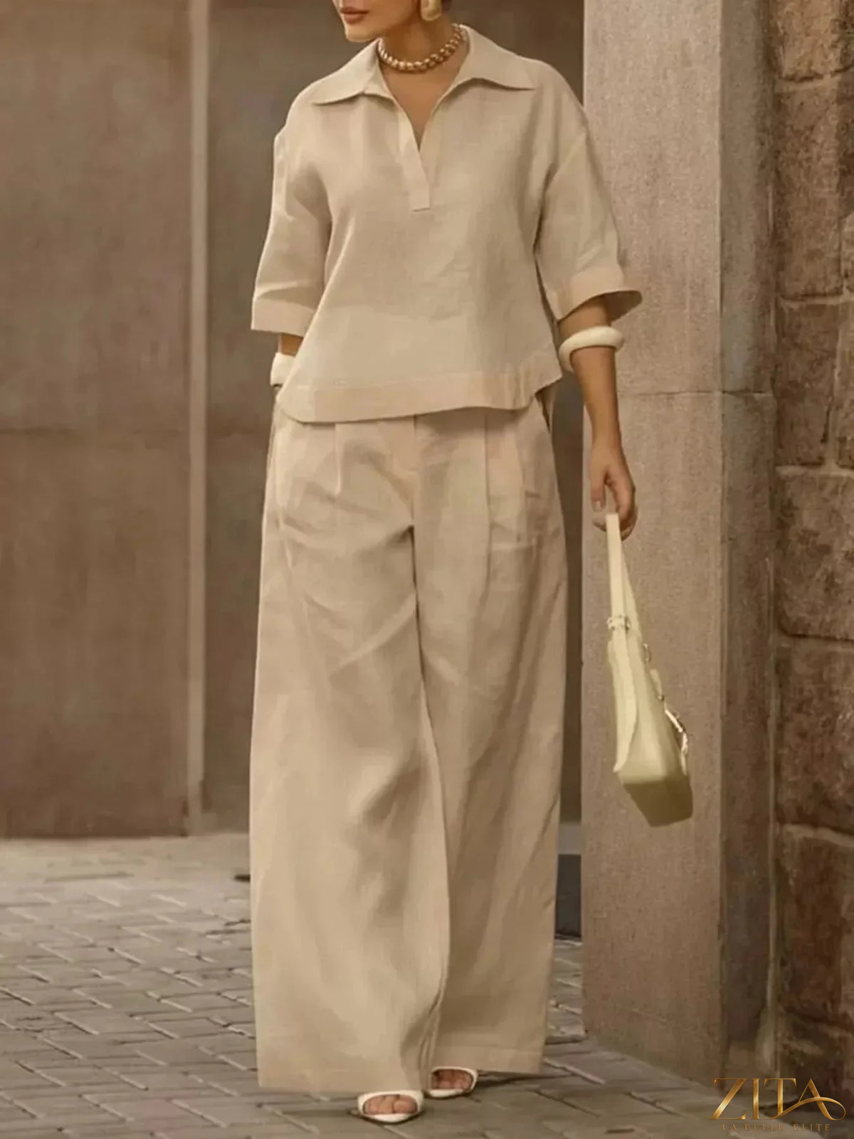 Plus size Zita La Belle Elite two-piece set with 3/4 sleeve top and wide-leg pants, shown in a stylish, comfortable fit.