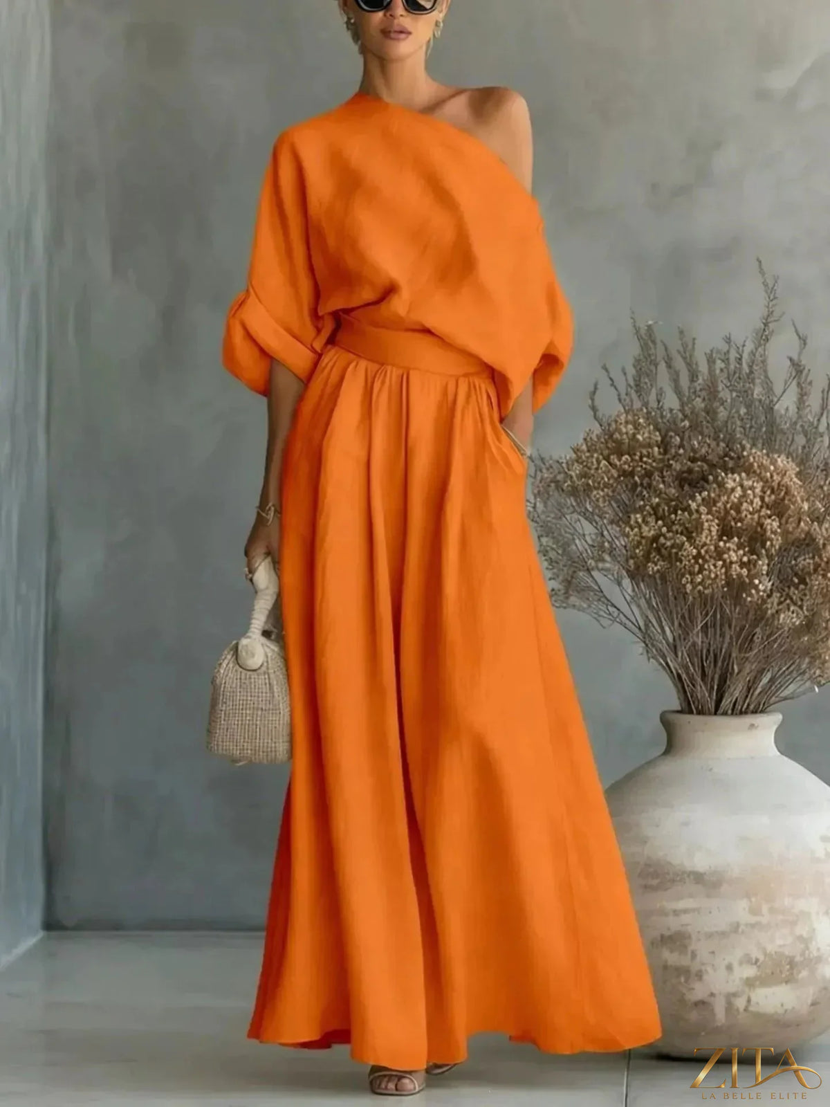 Plus size Zita La Belle Elite full size one-shoulder top and wide-leg pants set, shown on a model with a stylish, relaxed fit.