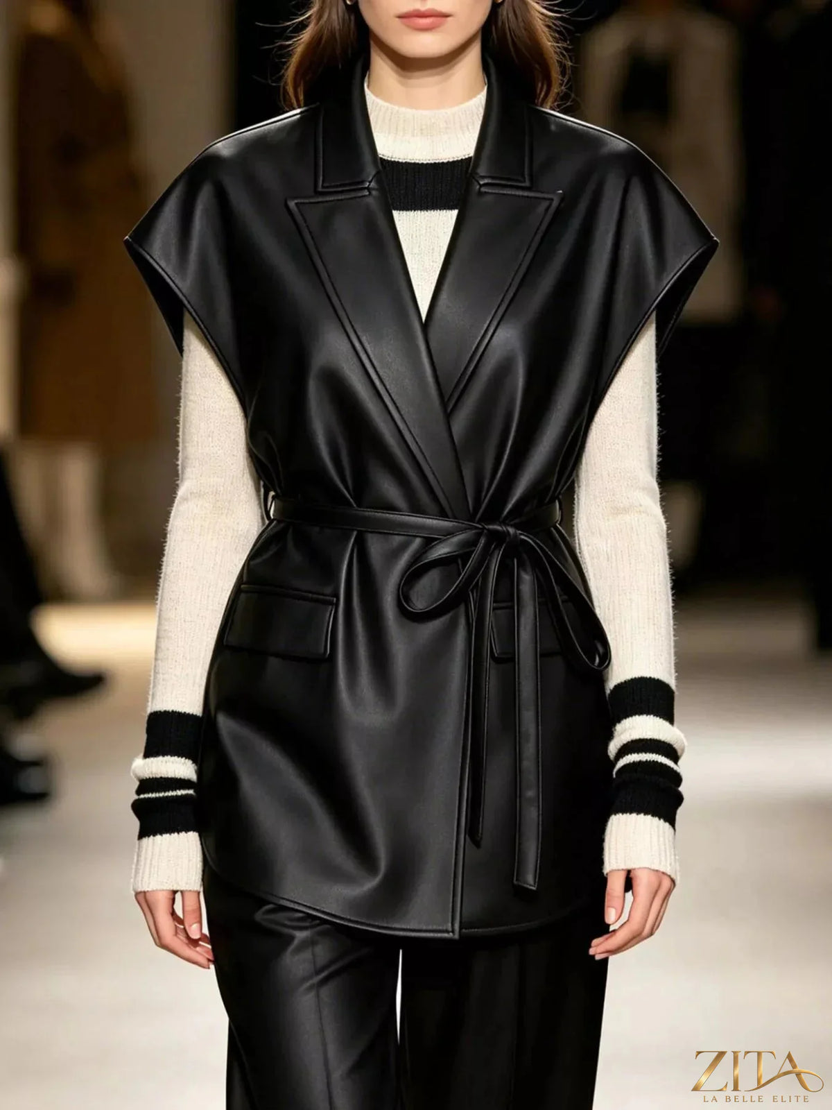 Zita La Belle Elite faux leather belted vest coat with a sleek design, featuring a front belt and tailored fit.