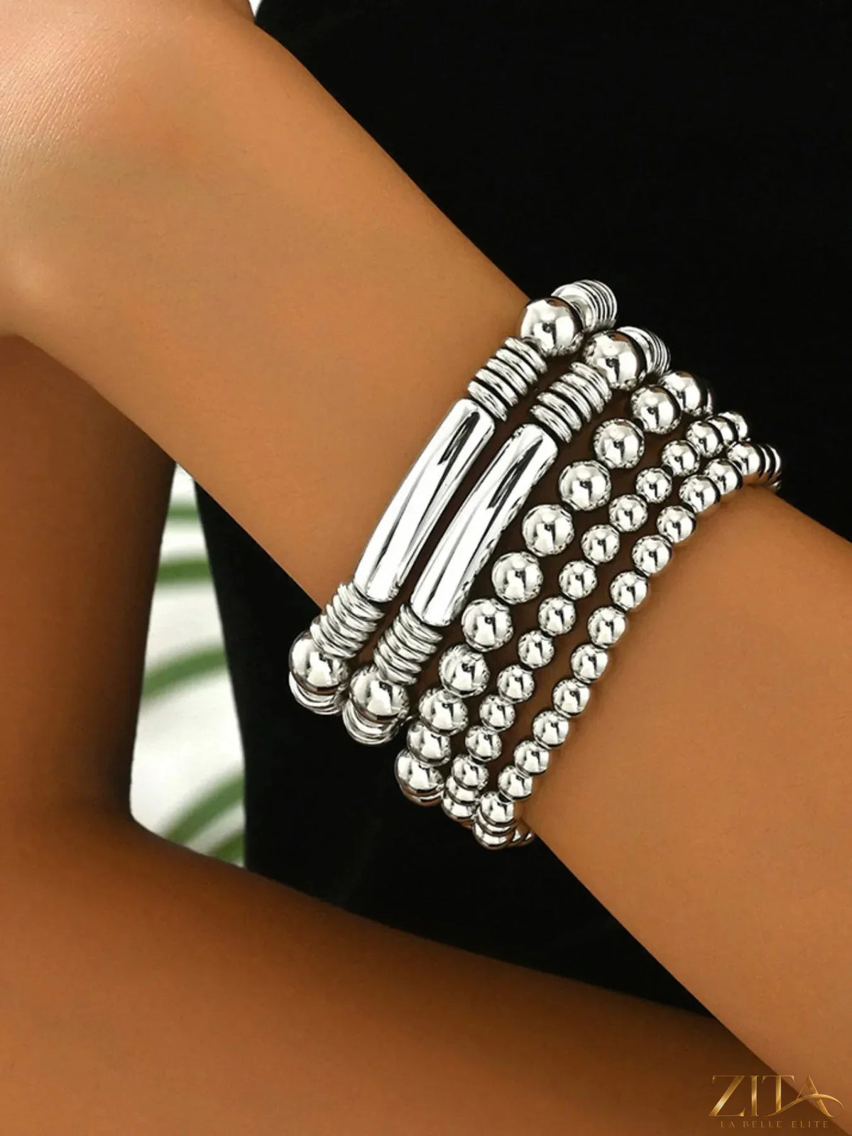 Colorful 5-piece plastic beaded bracelet set by Zita La Belle Elite featuring vibrant beads and adjustable stretch bands.