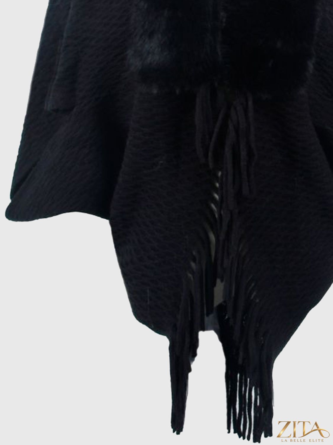 Open front fringe hem poncho by Trendsi featuring a flowing design and fringe details, perfect for stylish layering.
