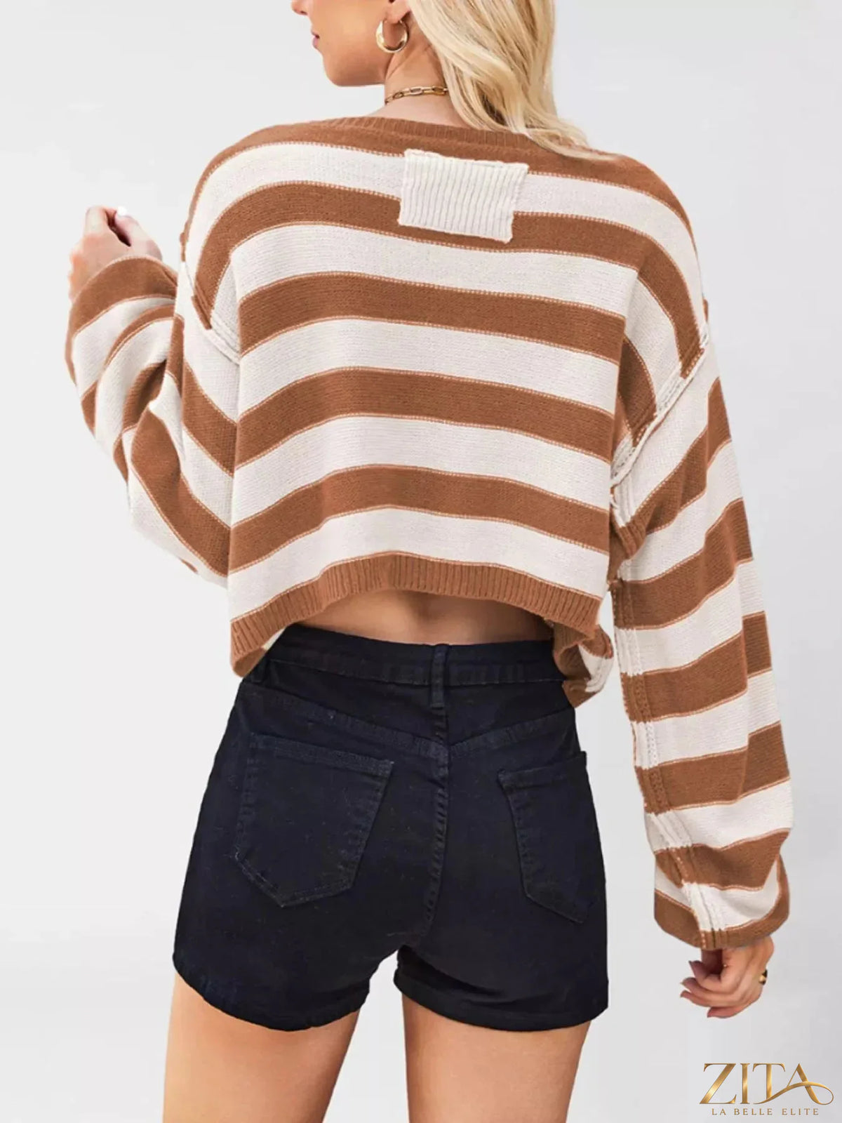 Striped boat neck sweater by Trendsi featuring a classic boat neck design and colorful horizontal stripes.