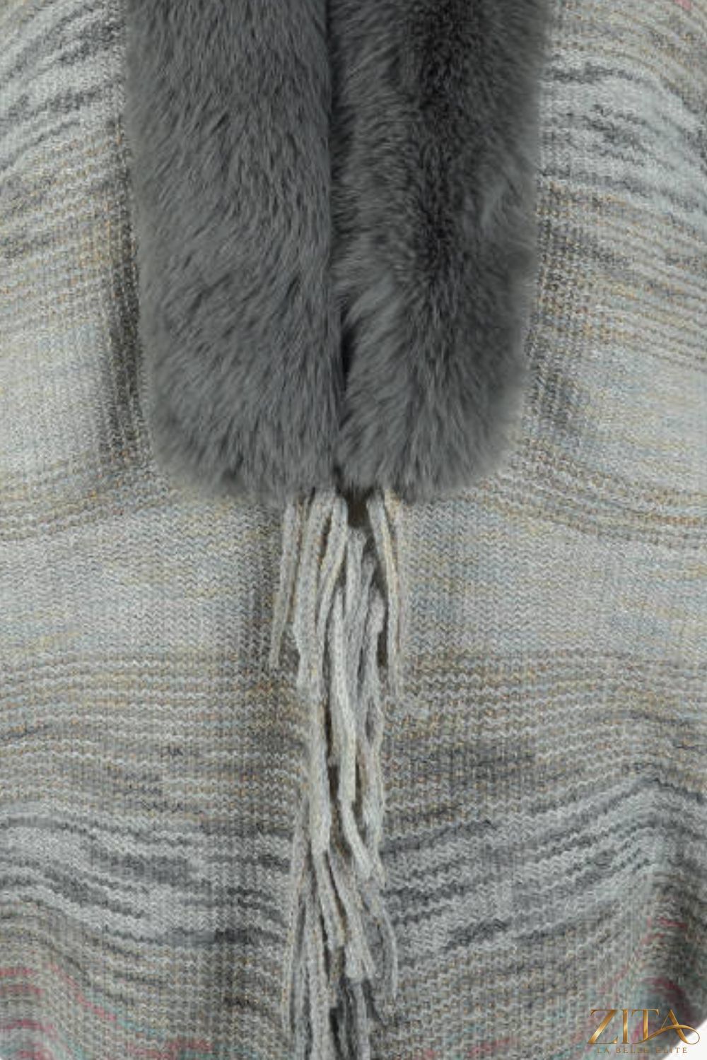 Open front fringe hem poncho by Trendsi, featuring a flowing design with fringe trim, perfect for layered fall and winter fashion.