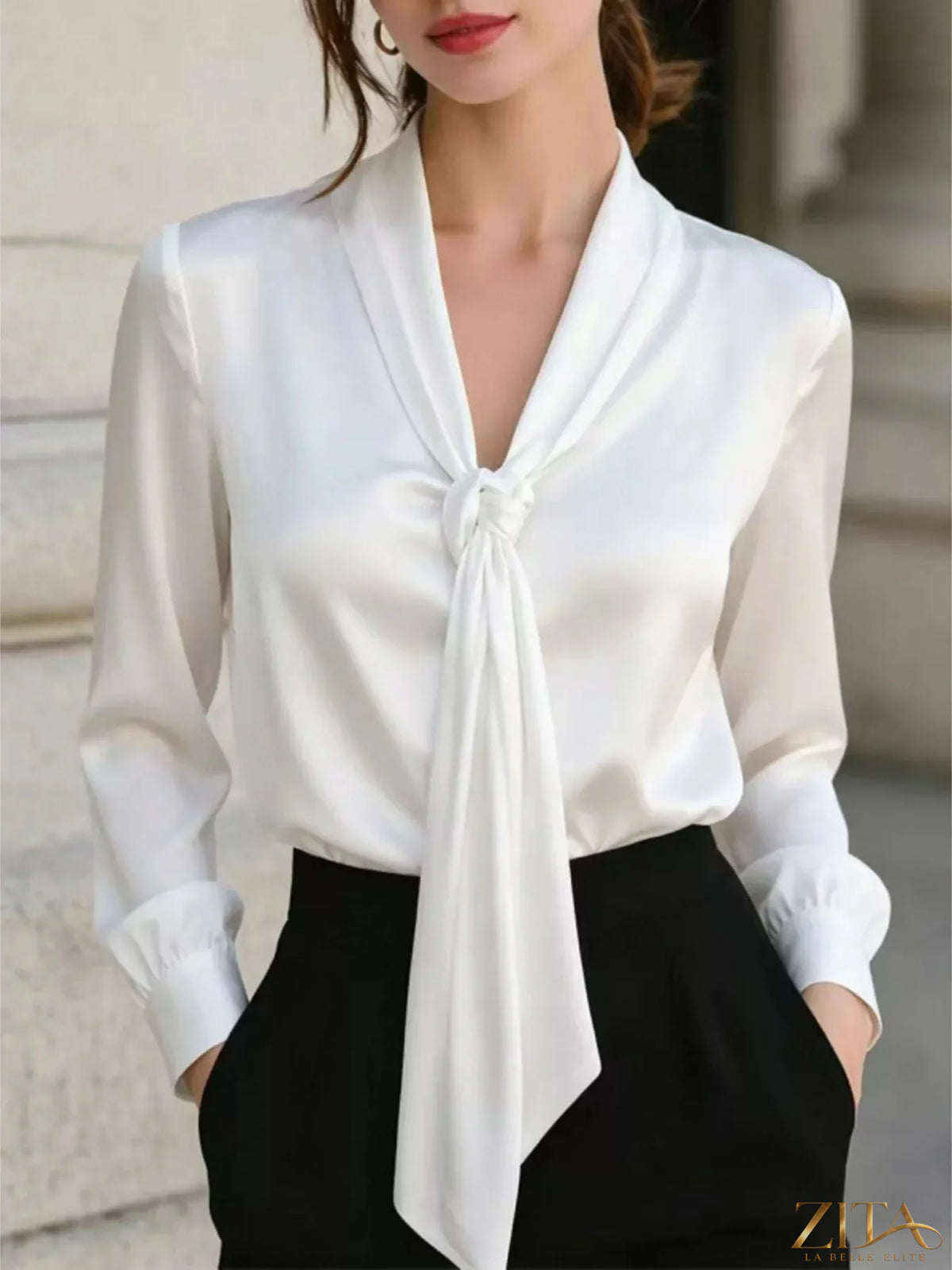 Zita La Belle Elite satin blouse with front tie detail, long sleeves and elegant design, perfect for stylish occasions.