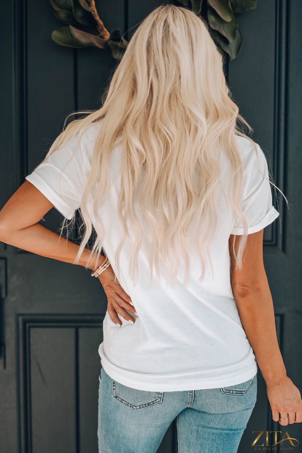 American HONEY cuffed T-shirt by Trendsi featuring a casual fit and soft fabric, shown in a relaxed fit with rolled cuffs.