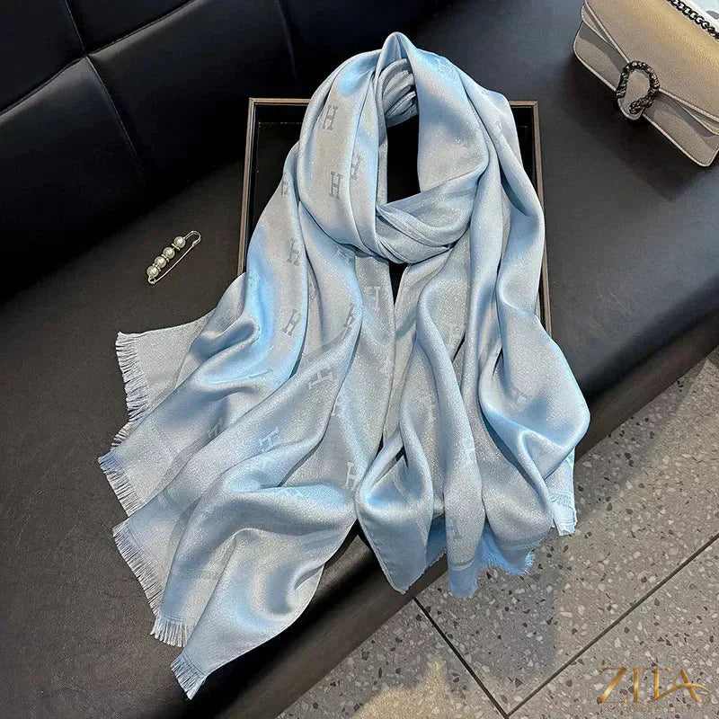Raw hem scarf from Trendsi featuring soft fabric and a stylish raw edge design, perfect for adding a chic touch to outfits.