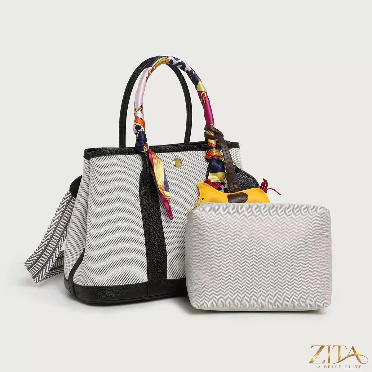 Canvas handbag from Zita La Belle Elite featuring a silk scarf and horse charm, shown with stylish details and elegant design.