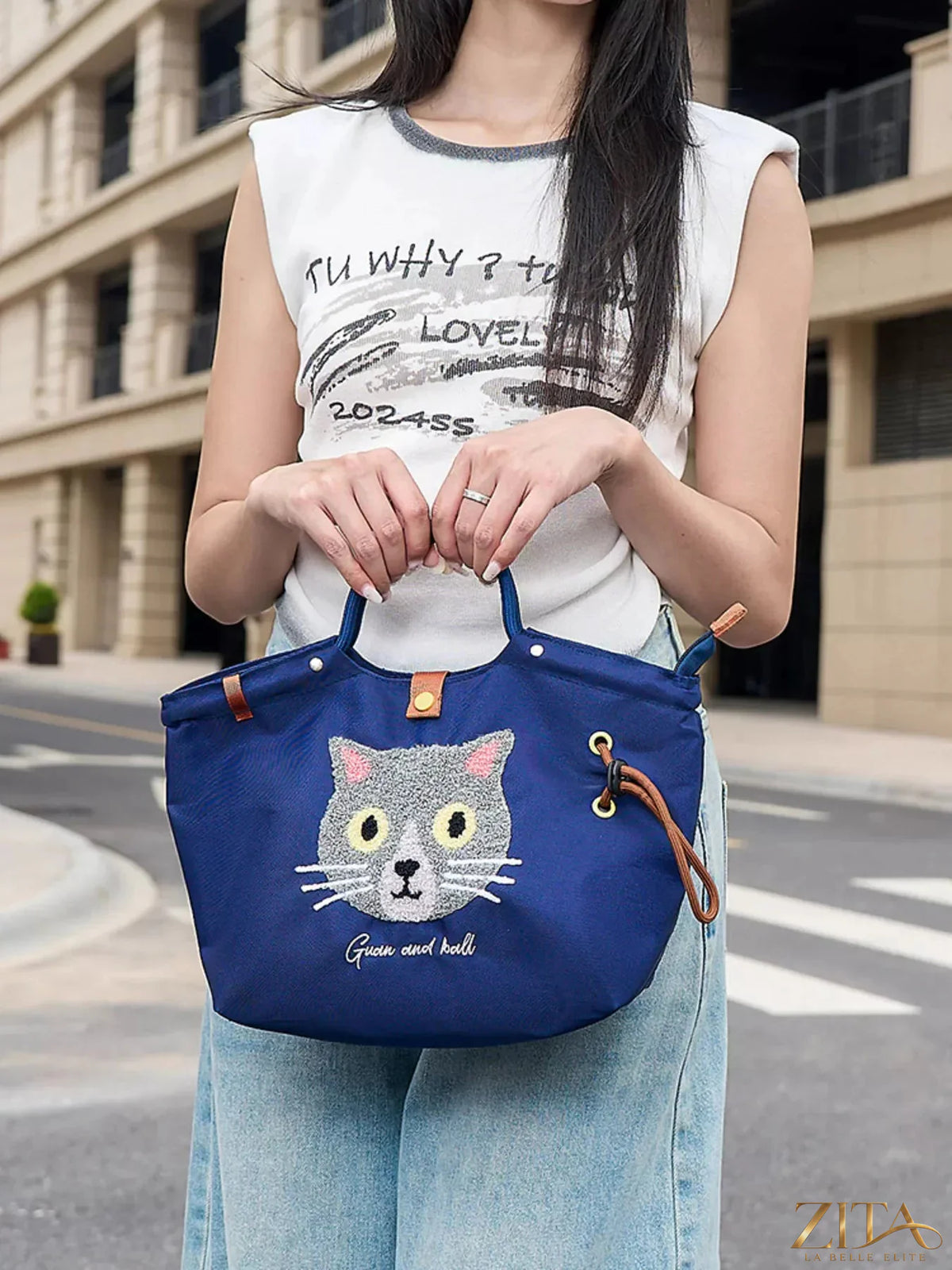 Embroidered cat tote bag by Zita La Belle Elite with adjustable shoulder strap, featuring detailed feline embroidery on fabric.