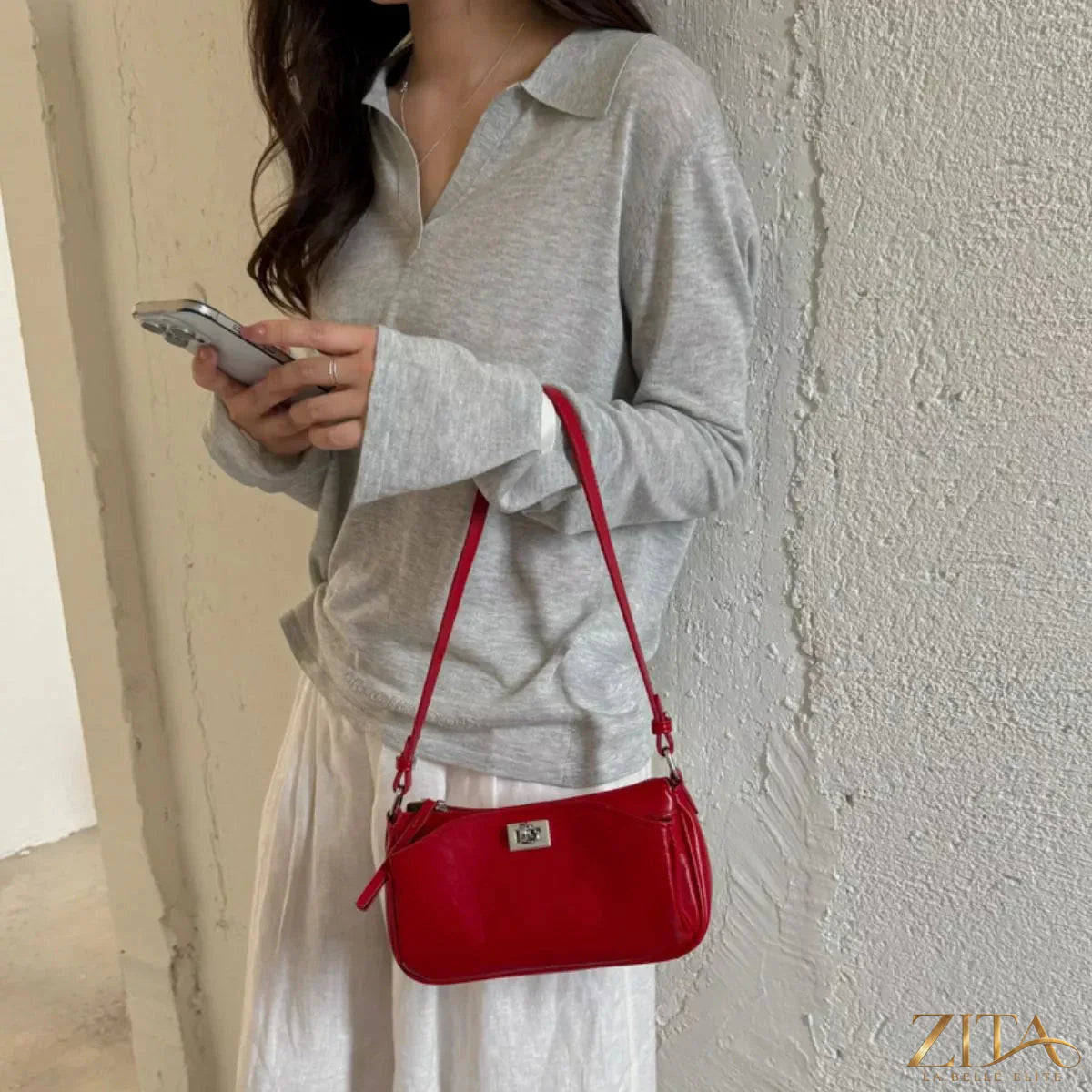 Trendsi PU leather shoulder bag with adjustable strap, featuring a structured design and minimalist style.